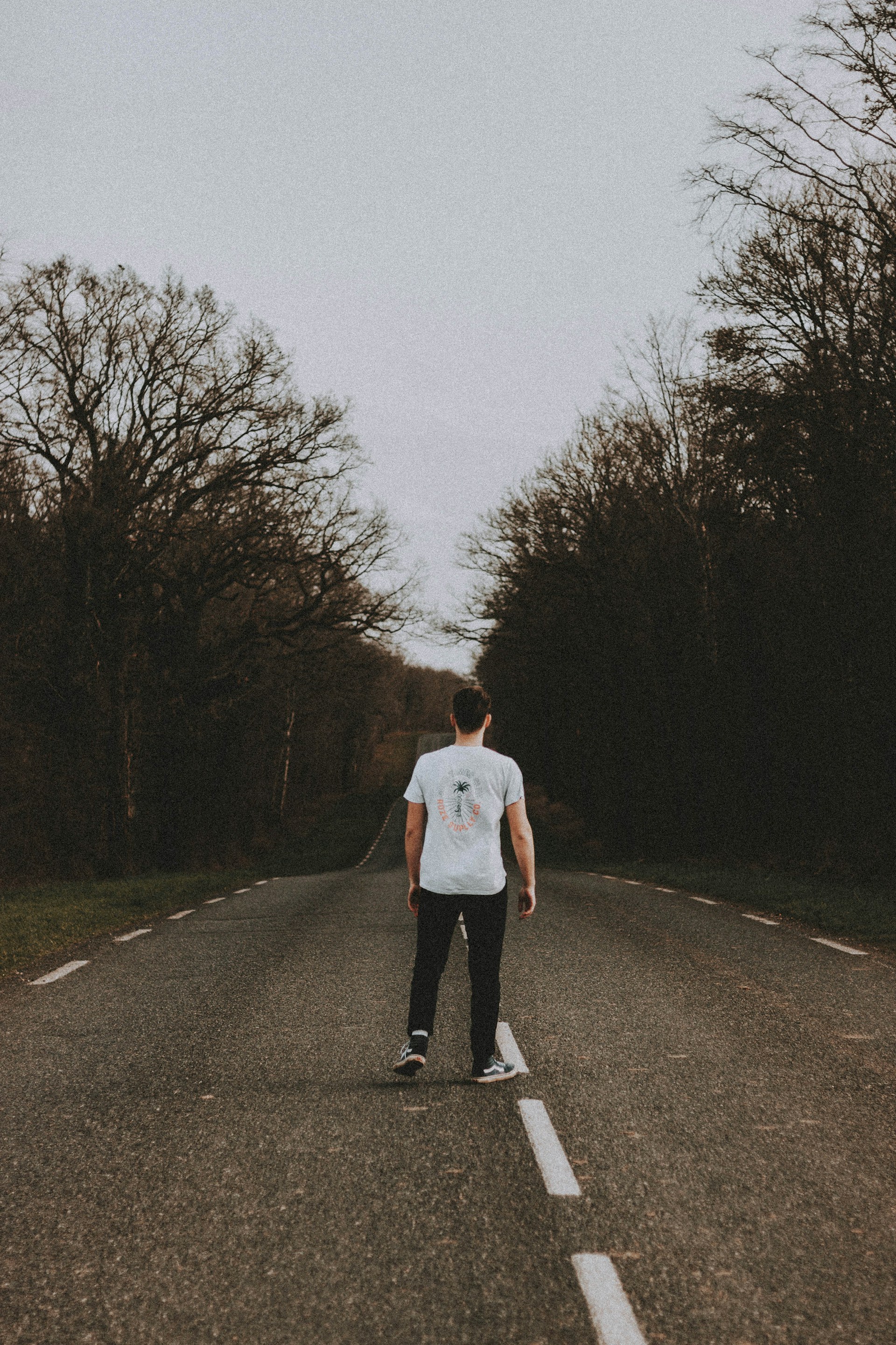 A young man standing on the road | Source: Unsplash
