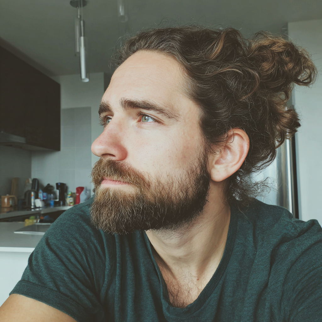 A pensive man sitting at a kitchen counter | Source: Midjourney