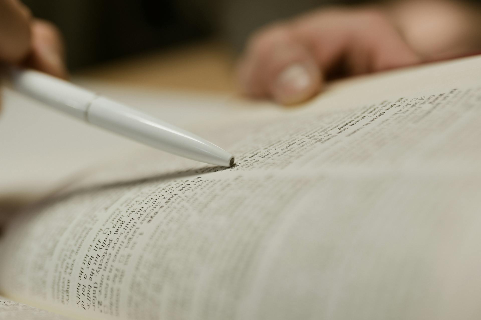 A person studying text in a book | Source: Pexels