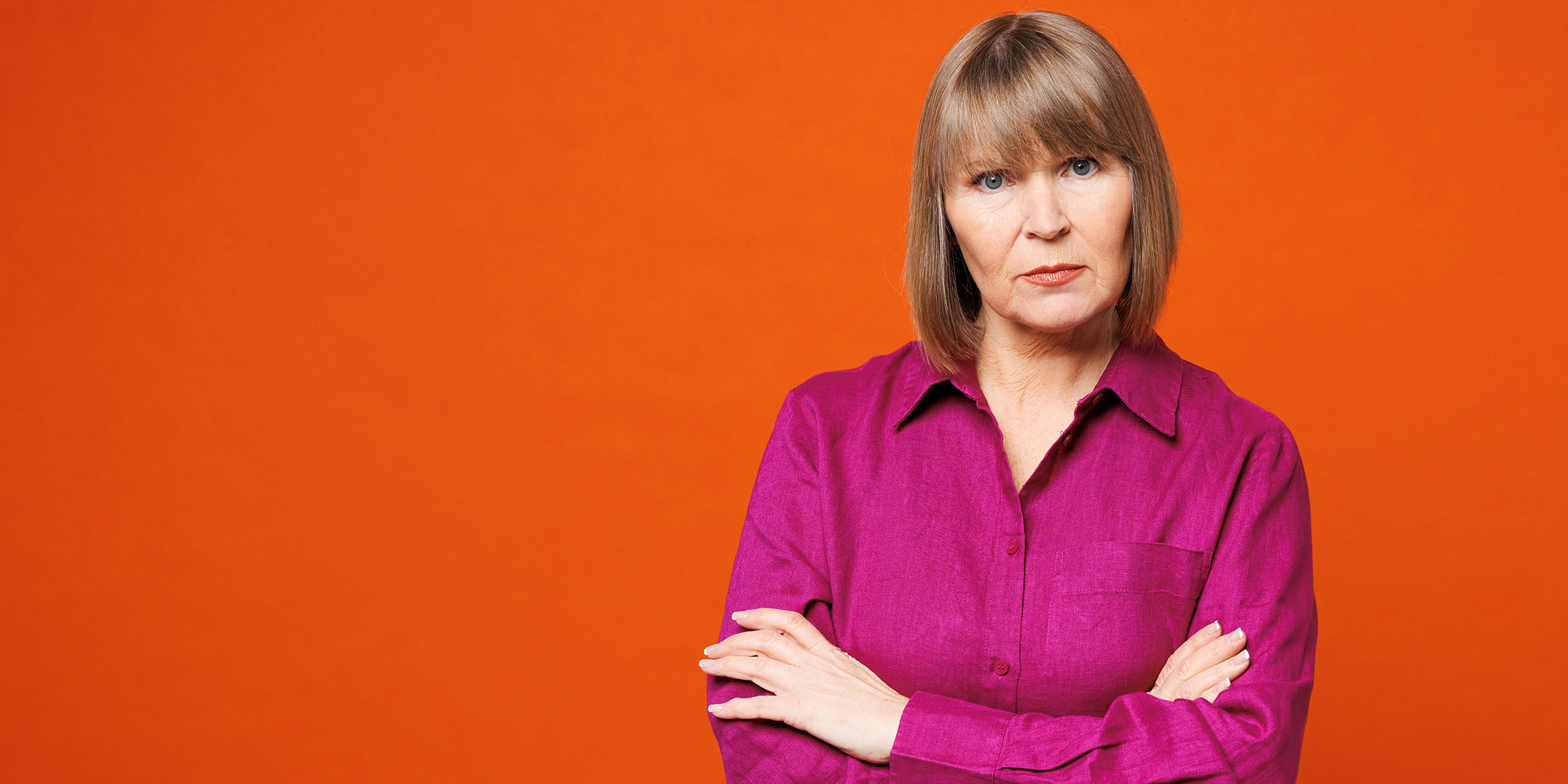 A stern-looking older woman | Source: Shutterstock