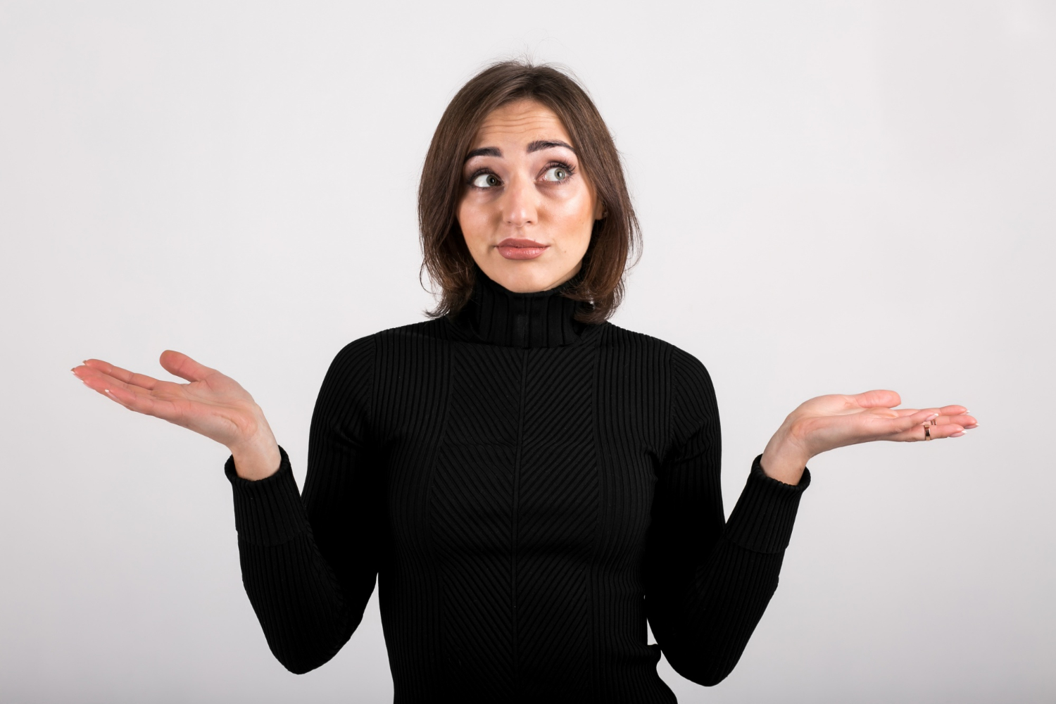 A woman shrugging | Source: Freepik