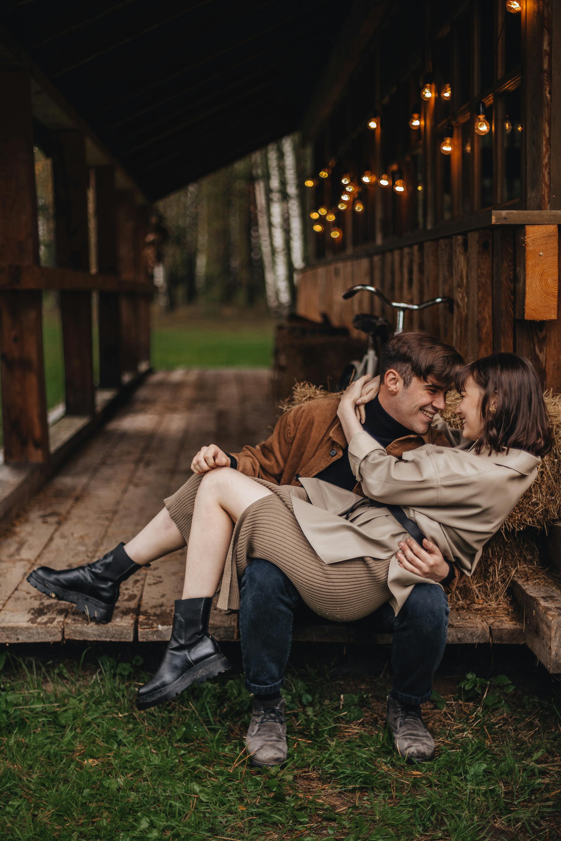 A woman sitting on a man's lap | Source: Pexels