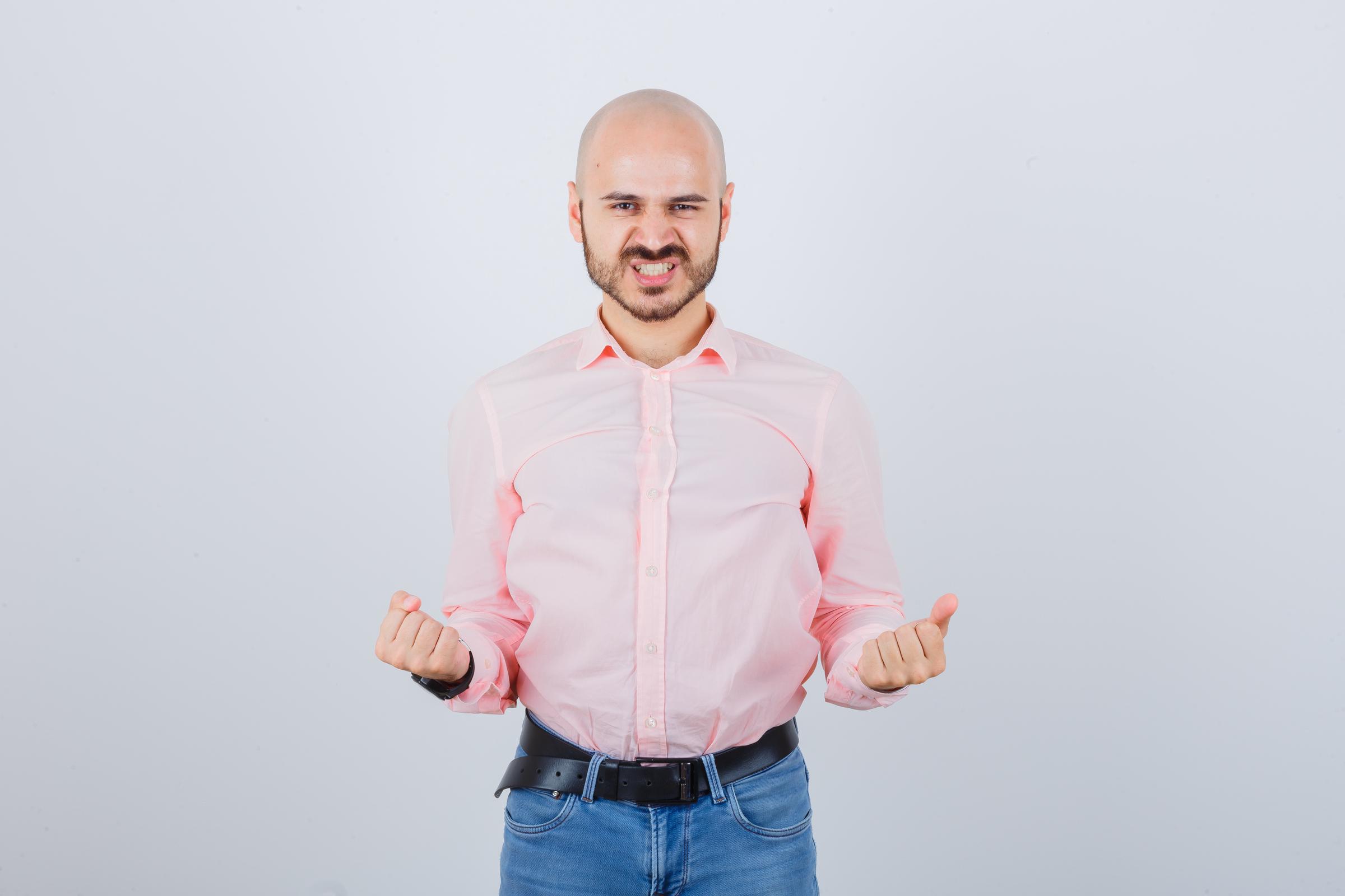 An angry man reacting | Source: Freepik