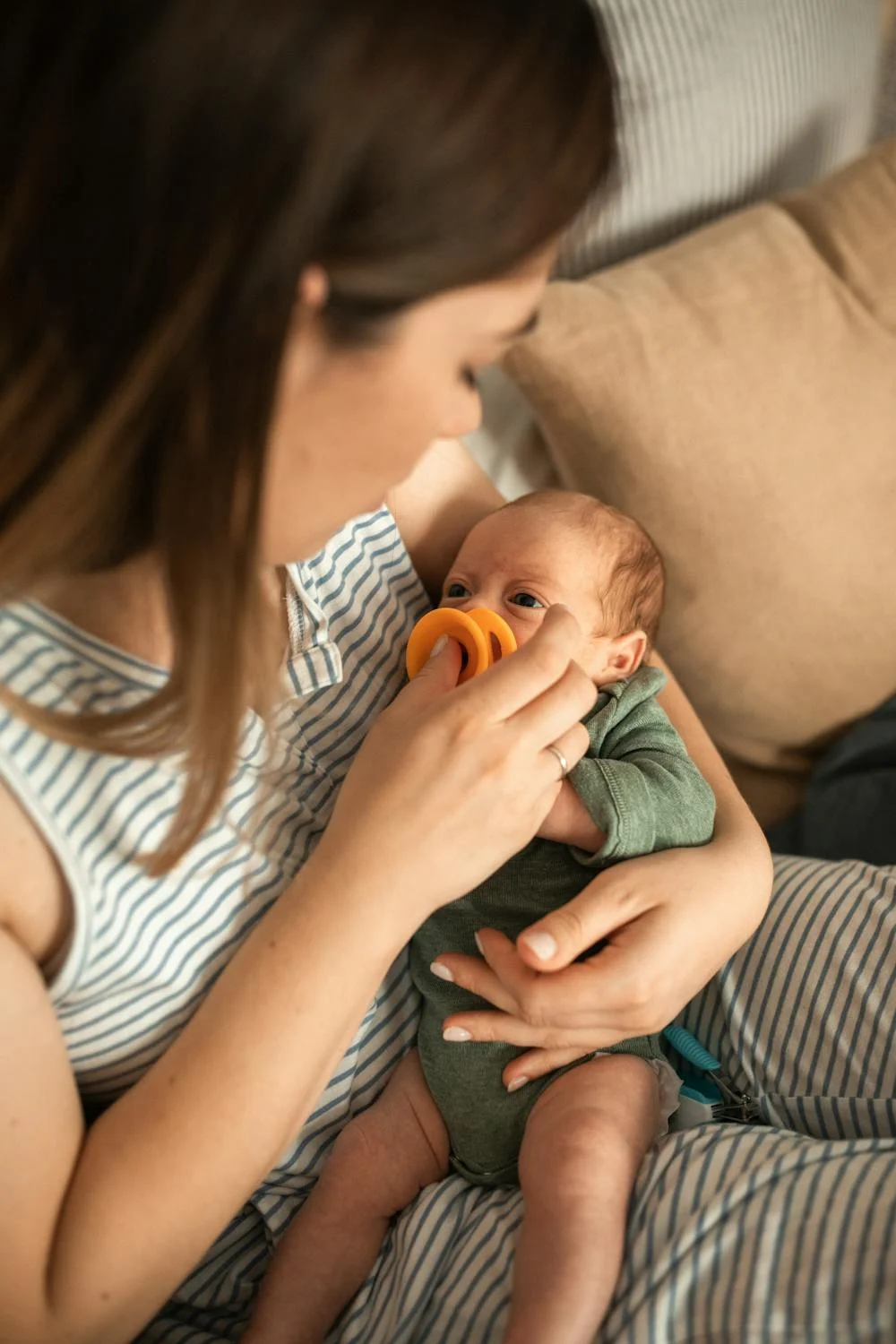 A woman holding a baby | Source: Pexels