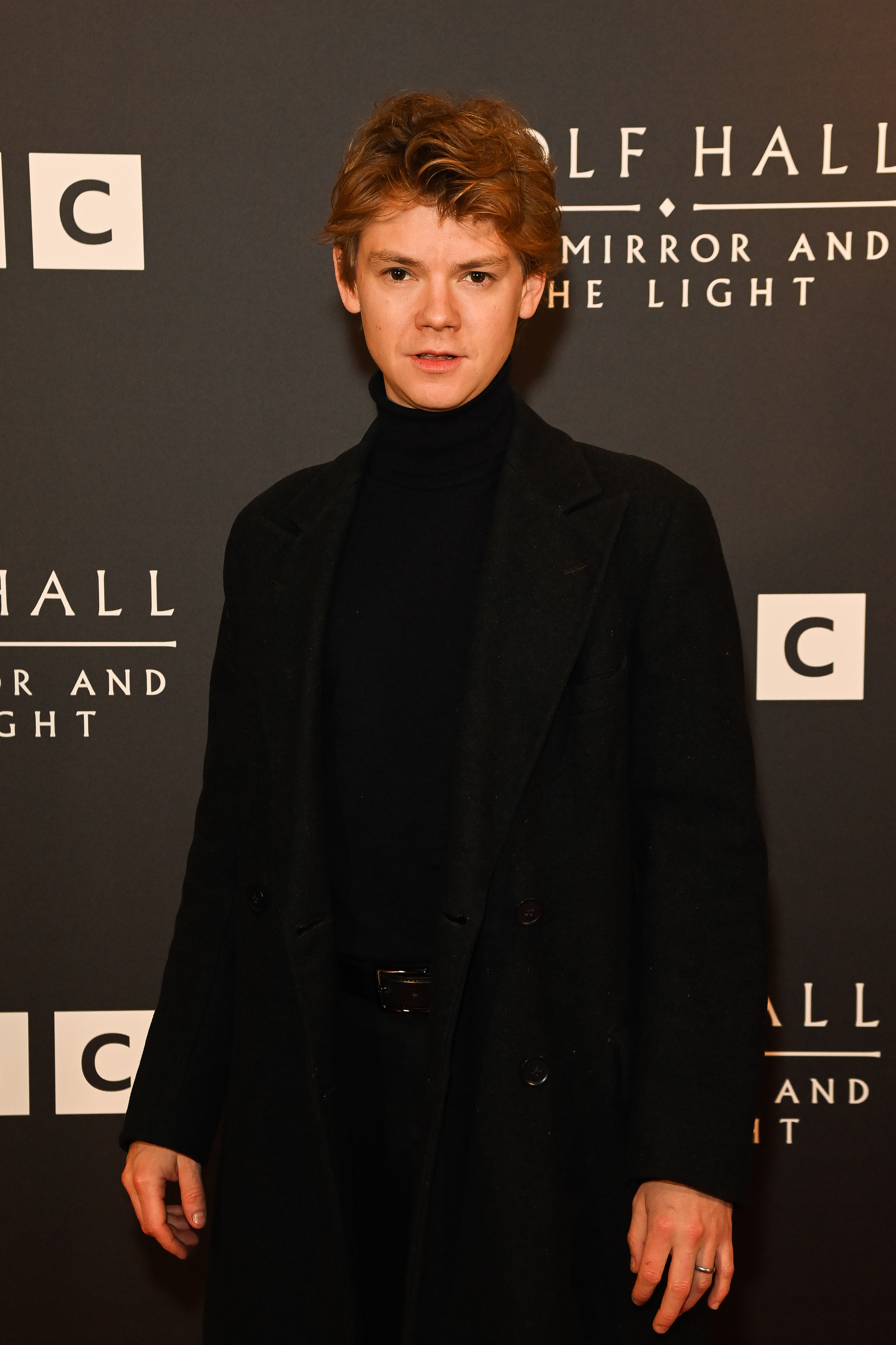 Brodie-Sangster, 34 in 2024, appeared at a London photocall for "Wolf Hall: The Mirror and the Light" with his signature slender frame, tousled hair, and boyish features still firmly intact. Dressed in an all-black ensemble with a modern cut, he carried himself with a quiet intensity that leaned more cerebral than rugged — a presence that felt both refined and reserved.