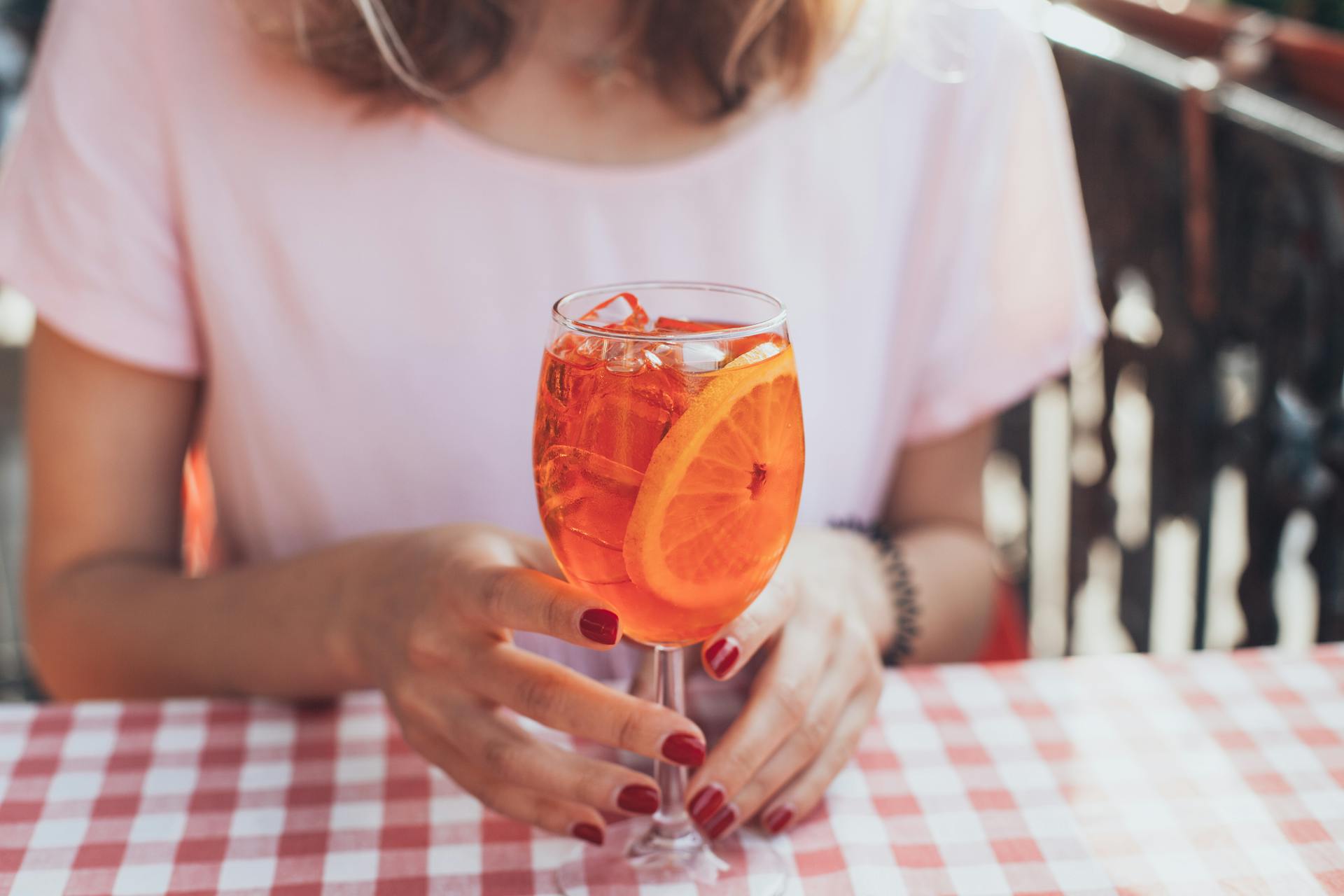 A woman seated at a table | Source: Pexels