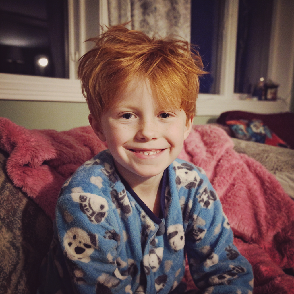 A little boy sitting on a couch | Source: Midjourney
