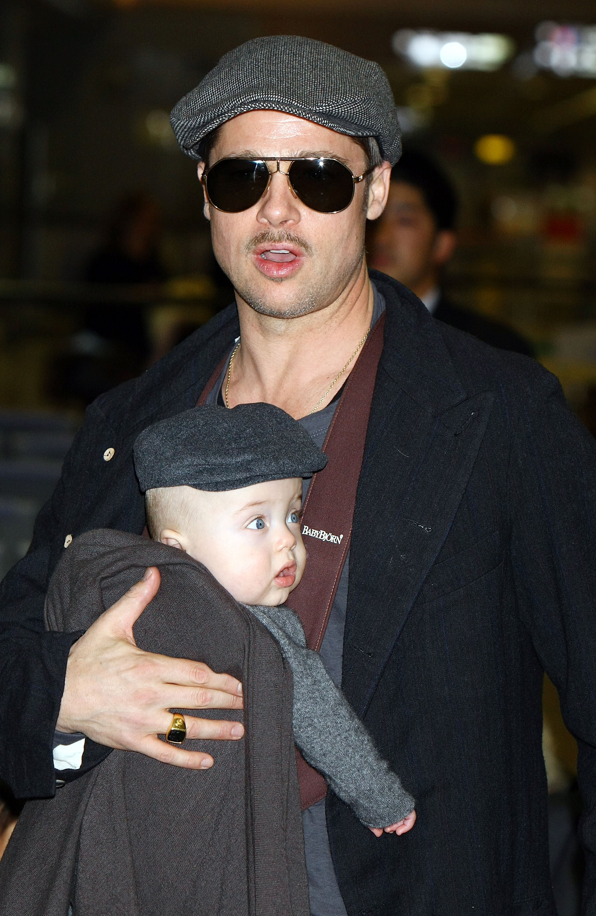 Brad Pitt at Narita International Airport in Chiba, Japan, with his child, Knox Jolie-Pitt, in Chiba, Japan, on January 27, 2009. | Source: Getty Images