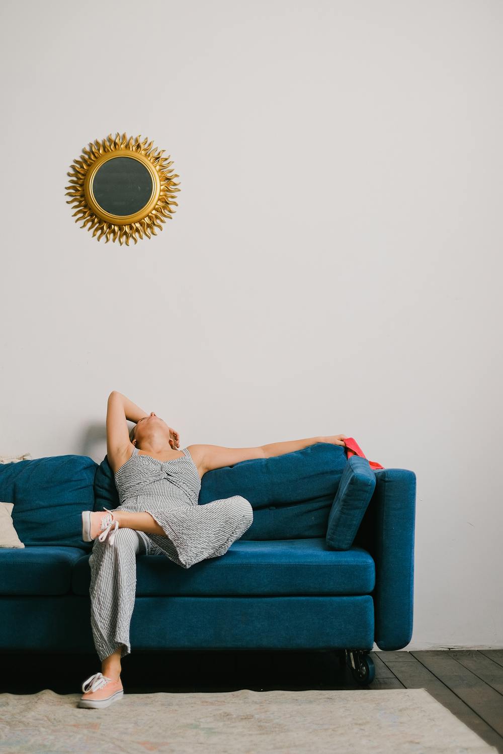 A tired woman on her couch | Source: Pexels