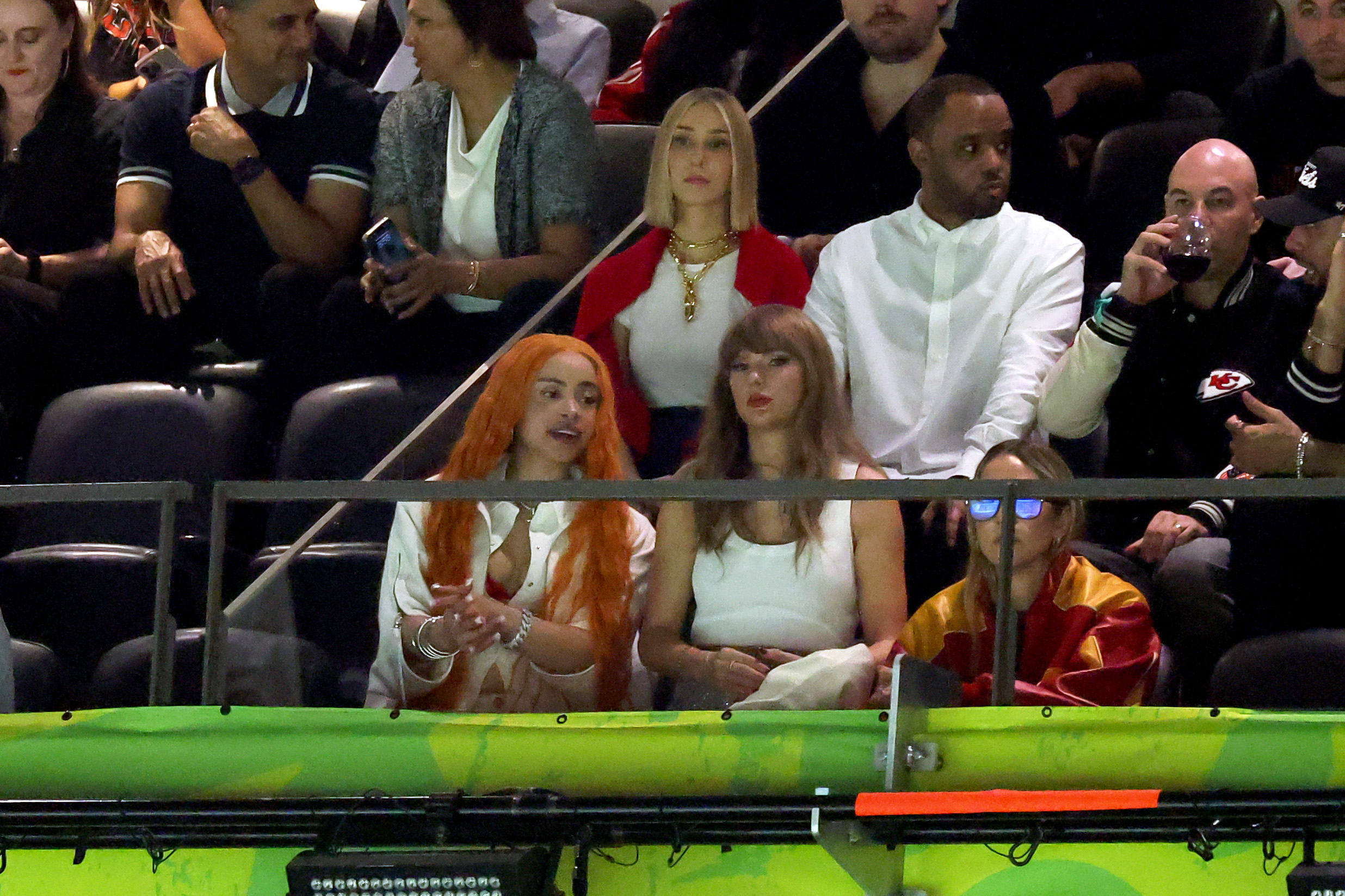 Ice Spice and Ashley Avignone sit with Taylor Swift as she watches her boyfriend play on February 9, 2025 | Source: Getty Images