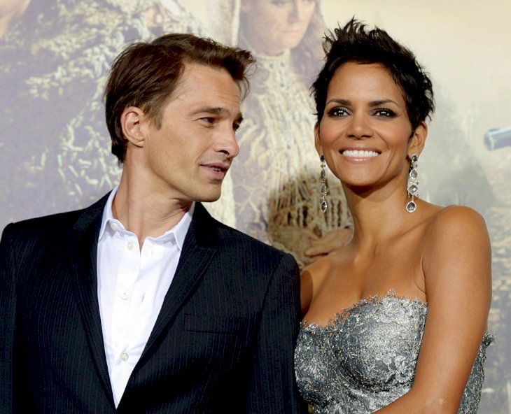 Halle Berry and actor Olivier Martinez arrive at the premiere of Warner Bros. Pictures' "Cloud Atlas" at the Chinese Theatre on October 24, 2012, in Los Angeles, California. | Photo by Kevin Winter/Getty Images