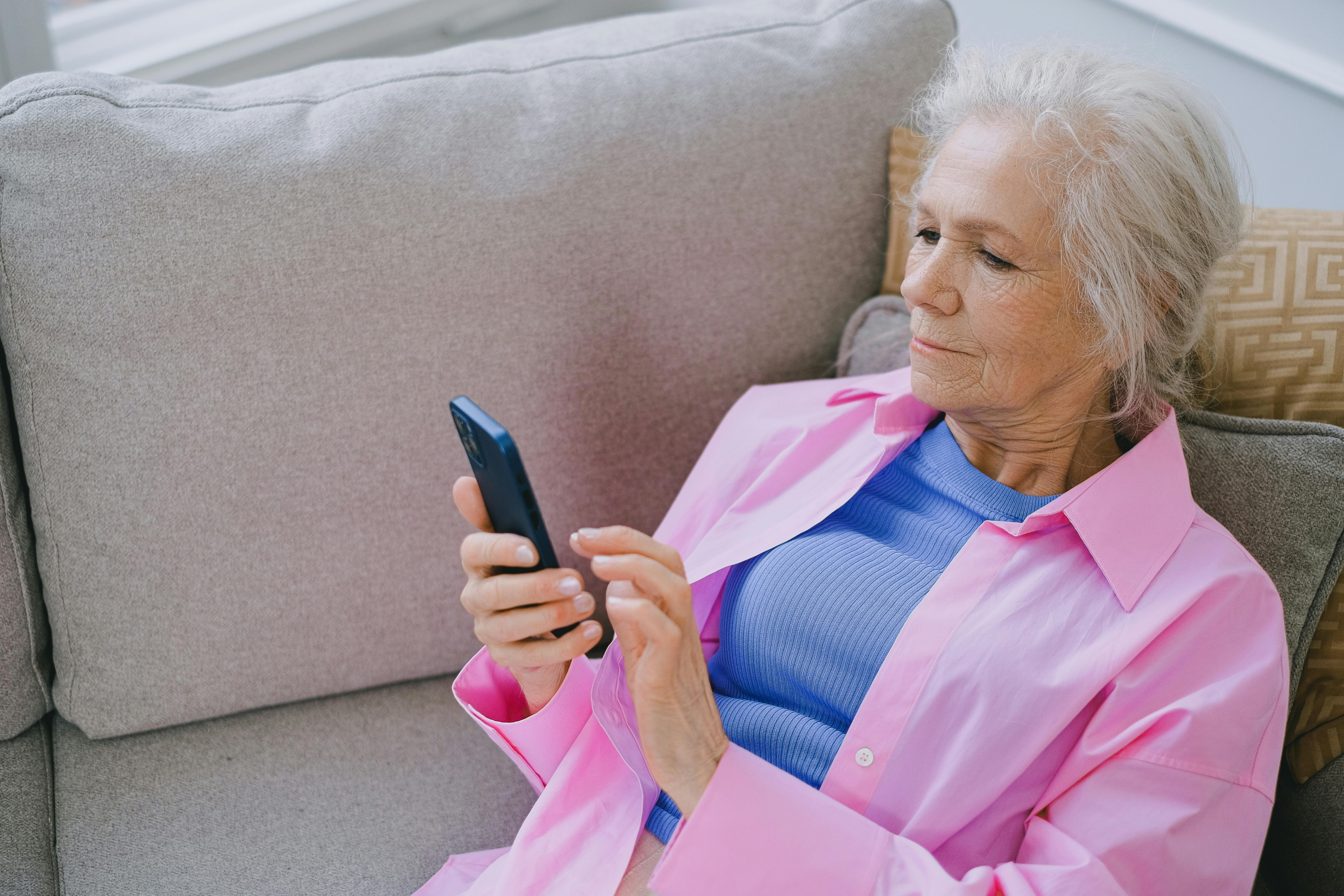 A woman looking at her phone | Source: Pexels