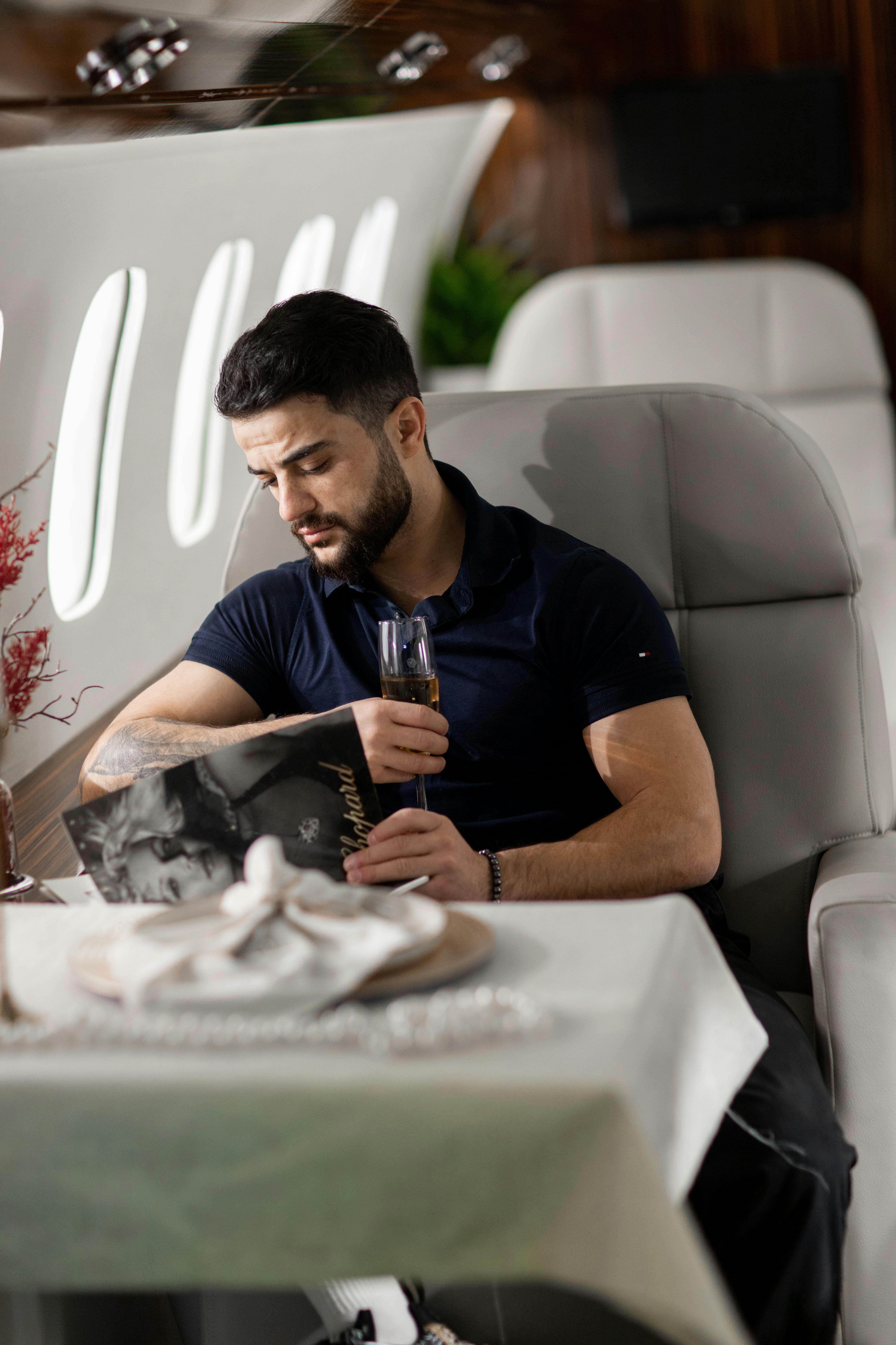 Man seated in business class | Source: Pexels