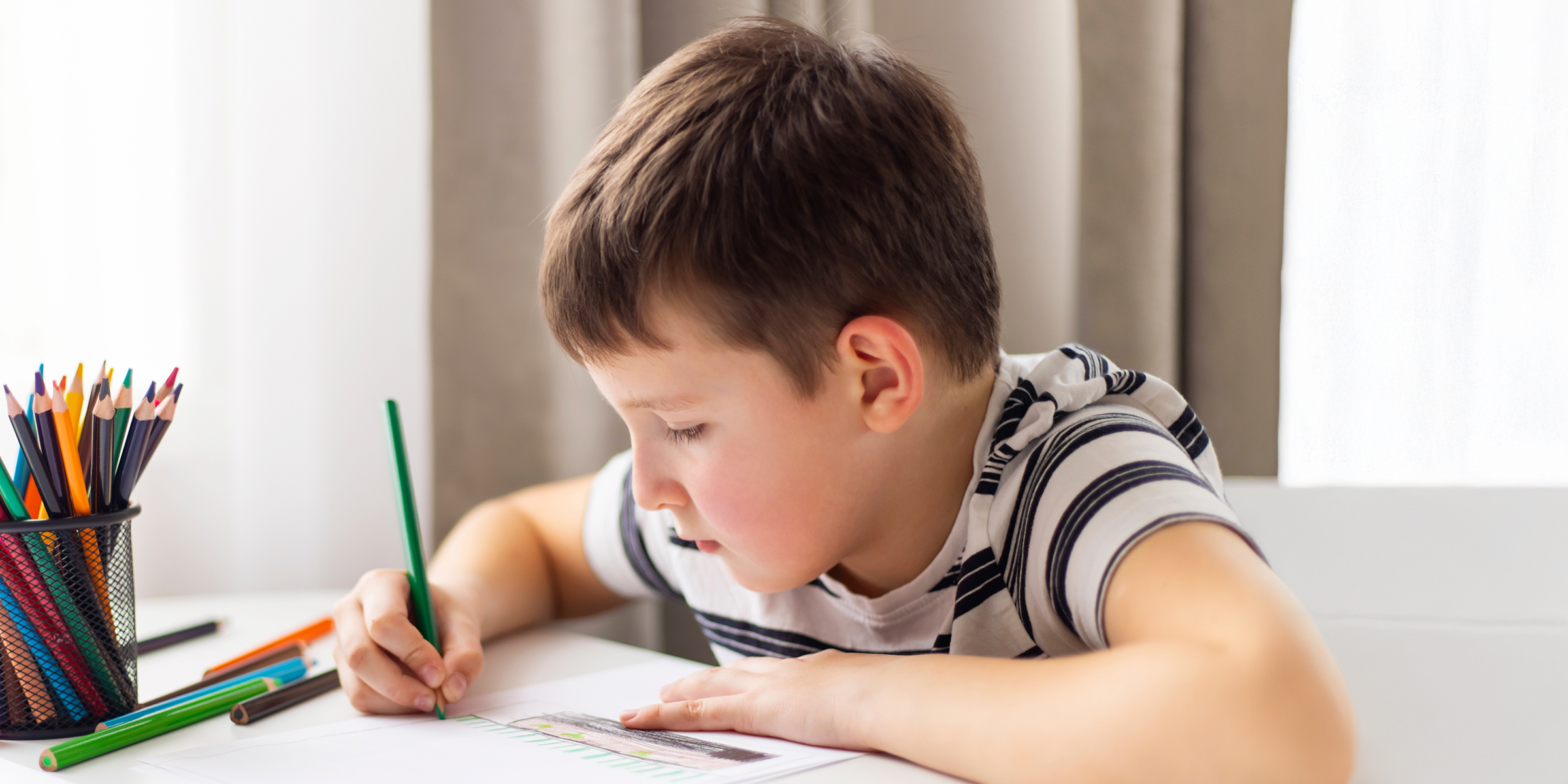 A boy doing his homework | Source: Shutterstock