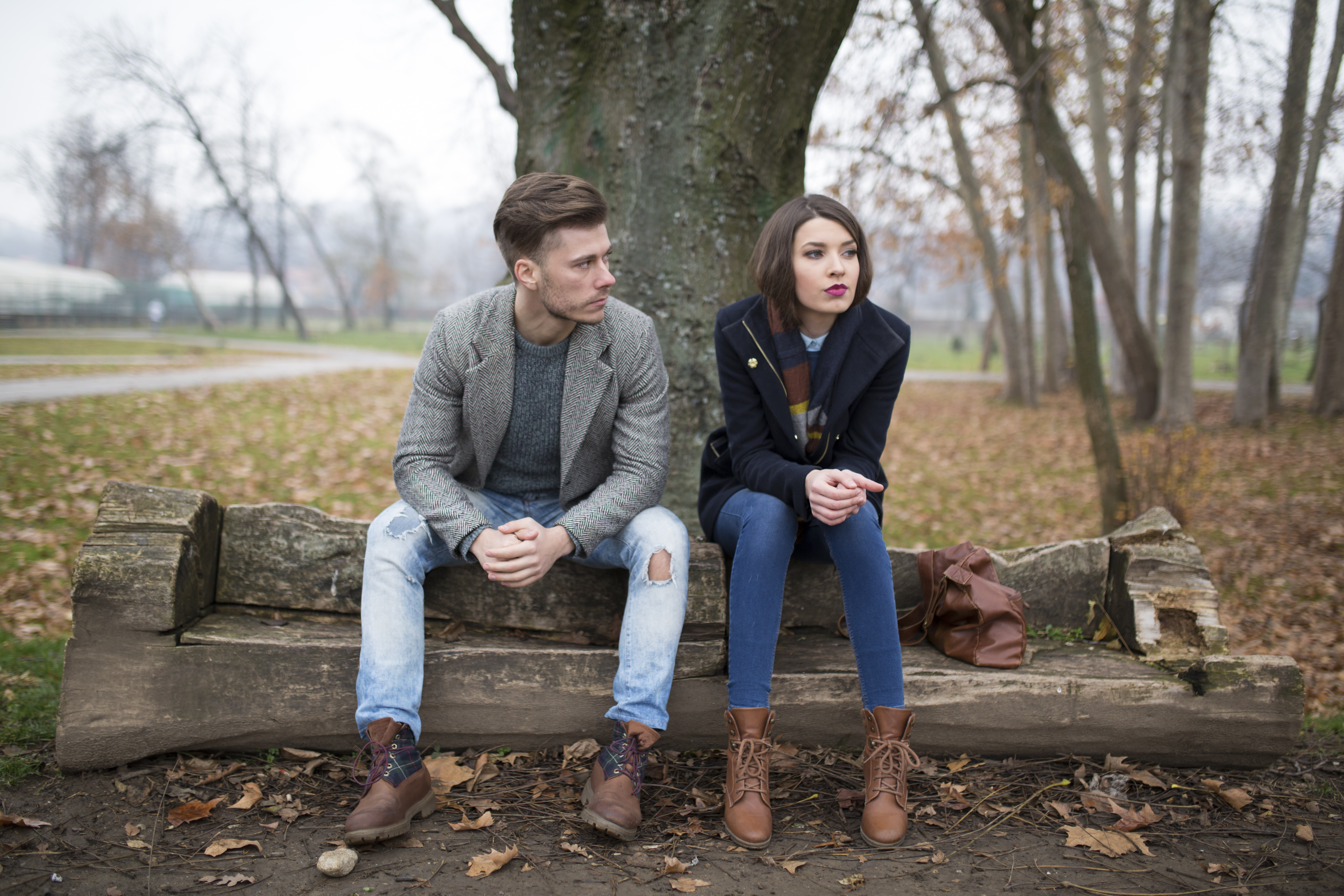 A couple sitting apart after an argument | Source: Getty Images