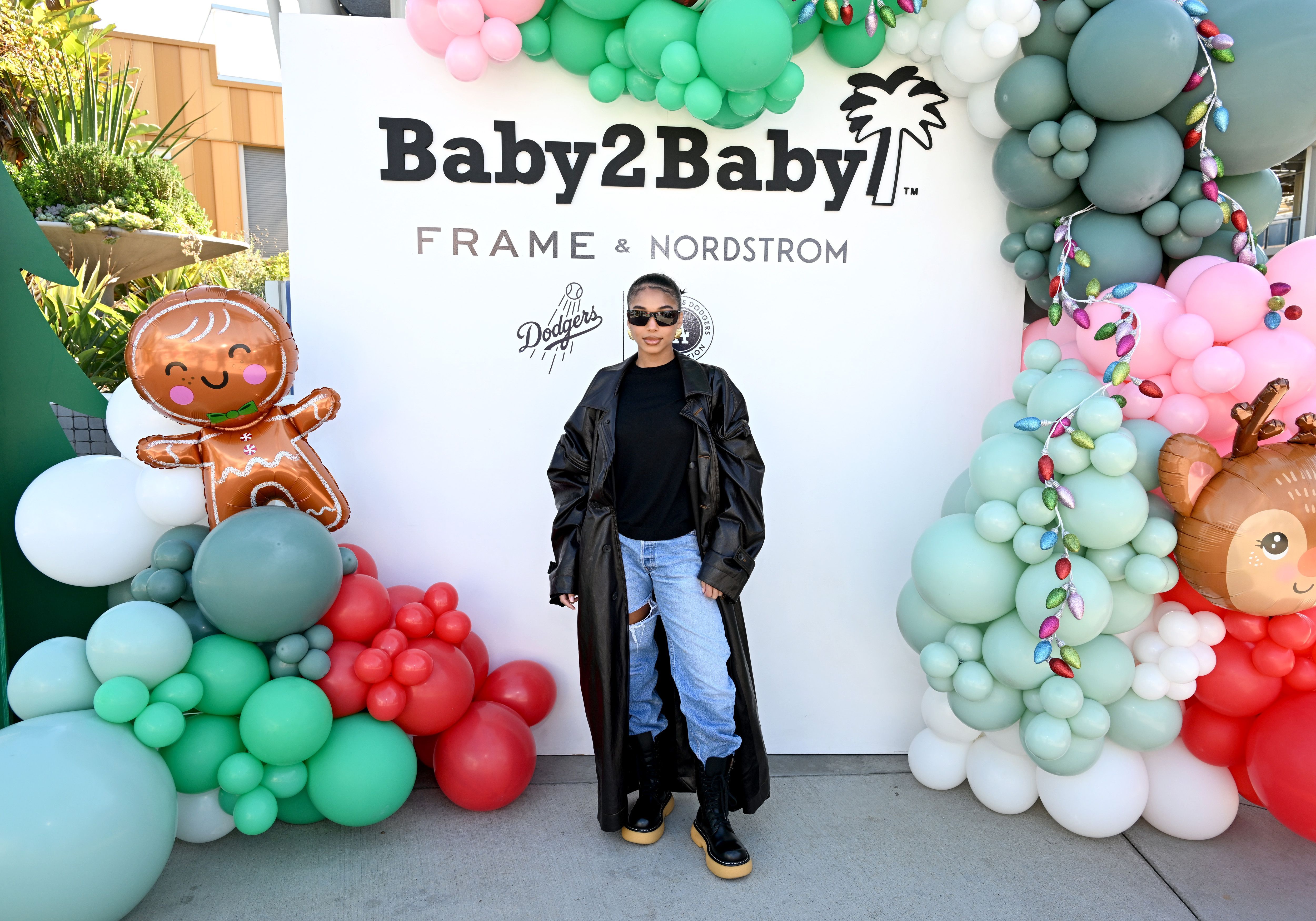 Lori Harvey at the 2023 Baby2Baby Holiday Distribution presented by FRAME & Nordstrom event in Los Angeles, California on December 13, 2023. | Source: Getty Images