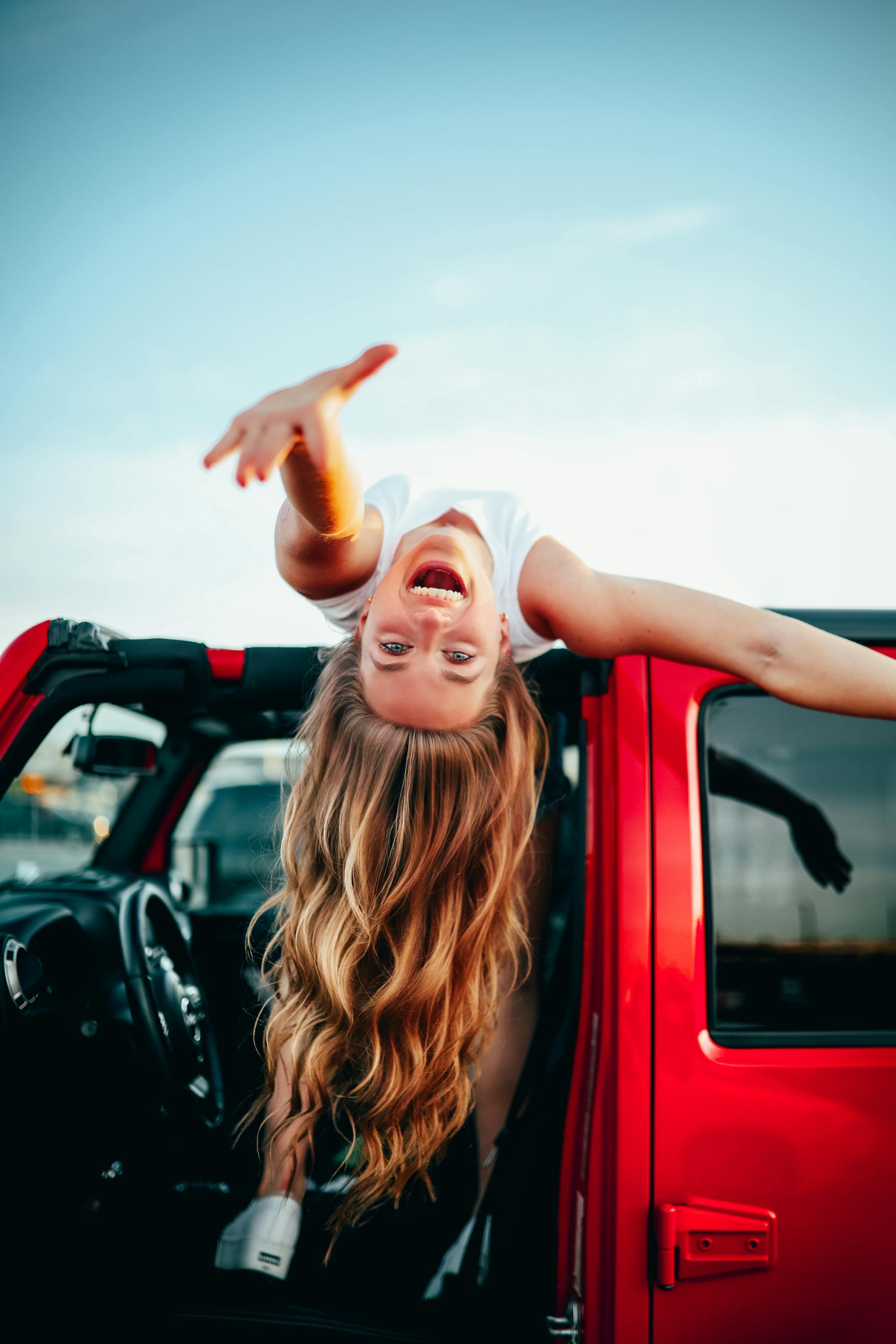 A happy girl in a car | Source: Pexels