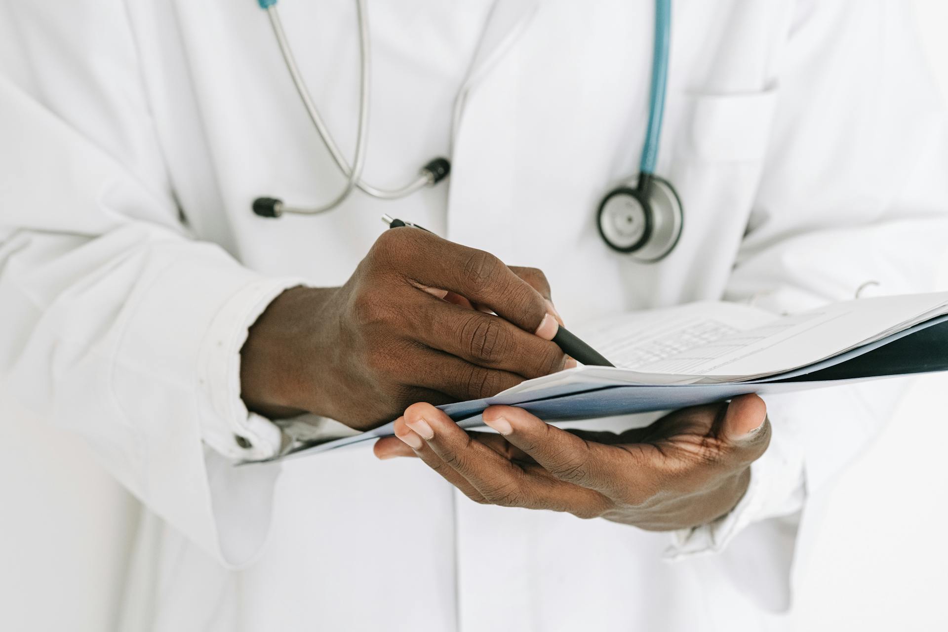 A doctor looking at a report | Source: Pexels
