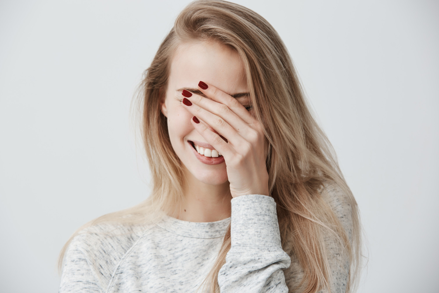 A shy and delighted woman | Source: Freepik