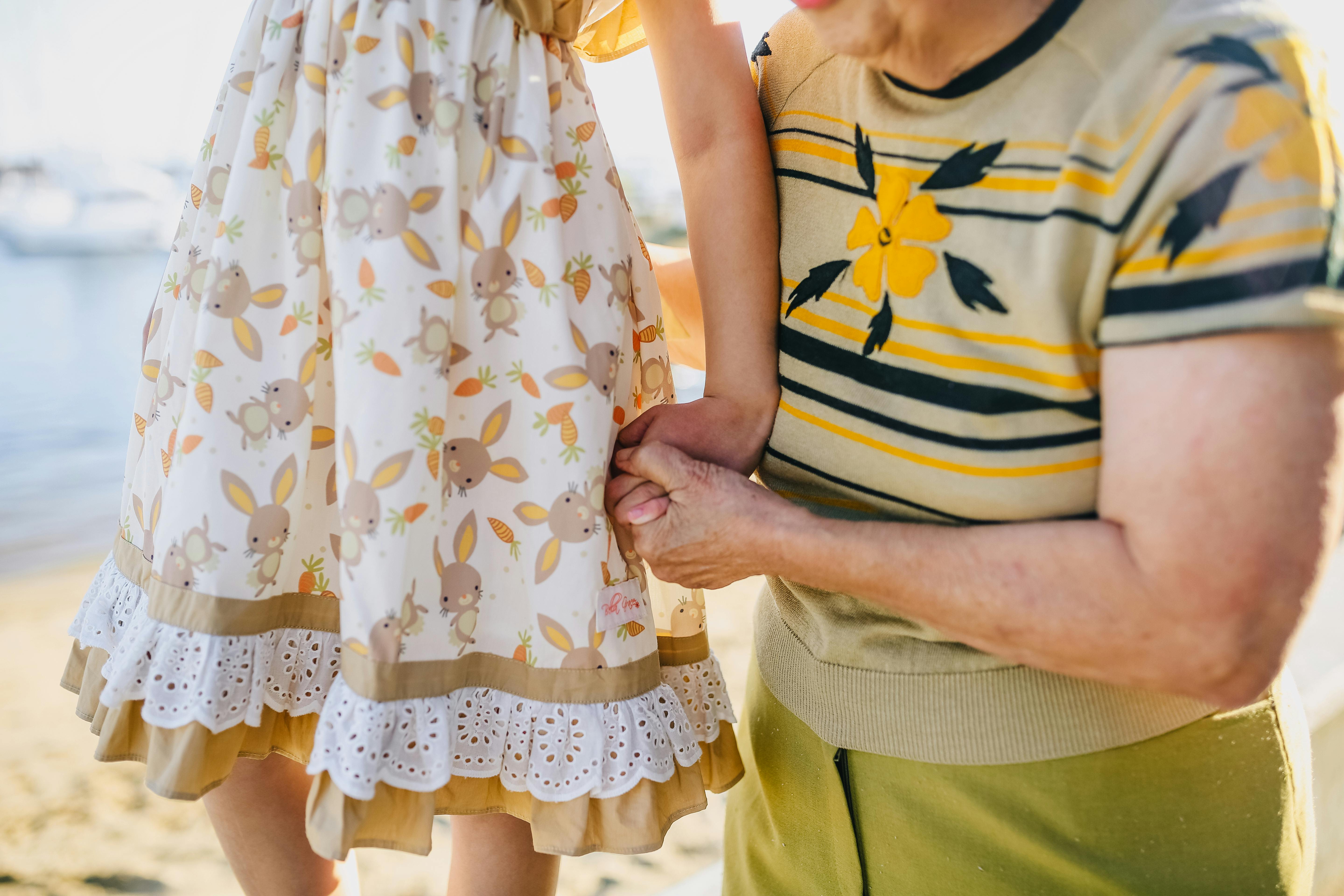 A woman playing with a child by the beach | Source: Pexels