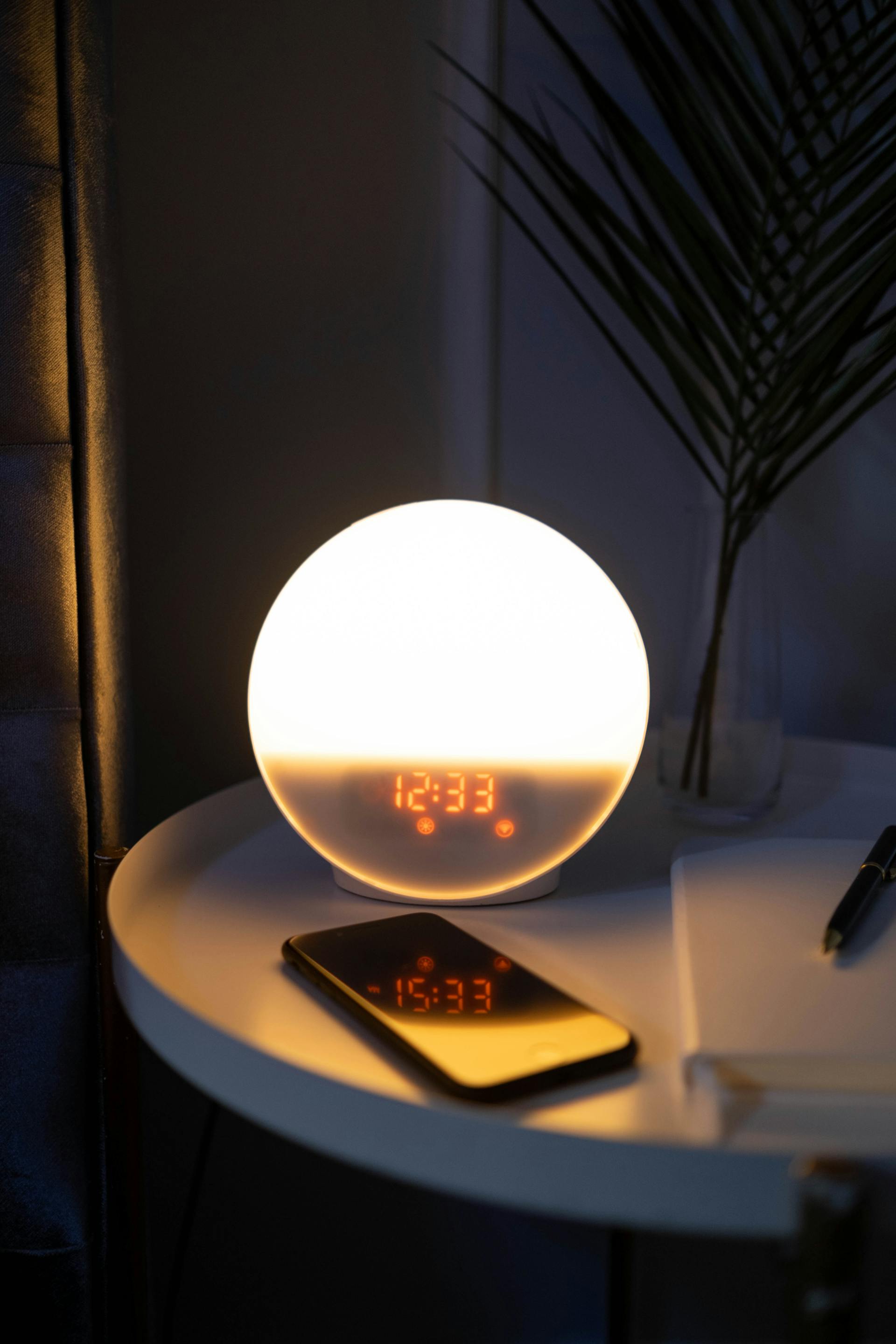 A phone on a nightstand | Source: Pexels