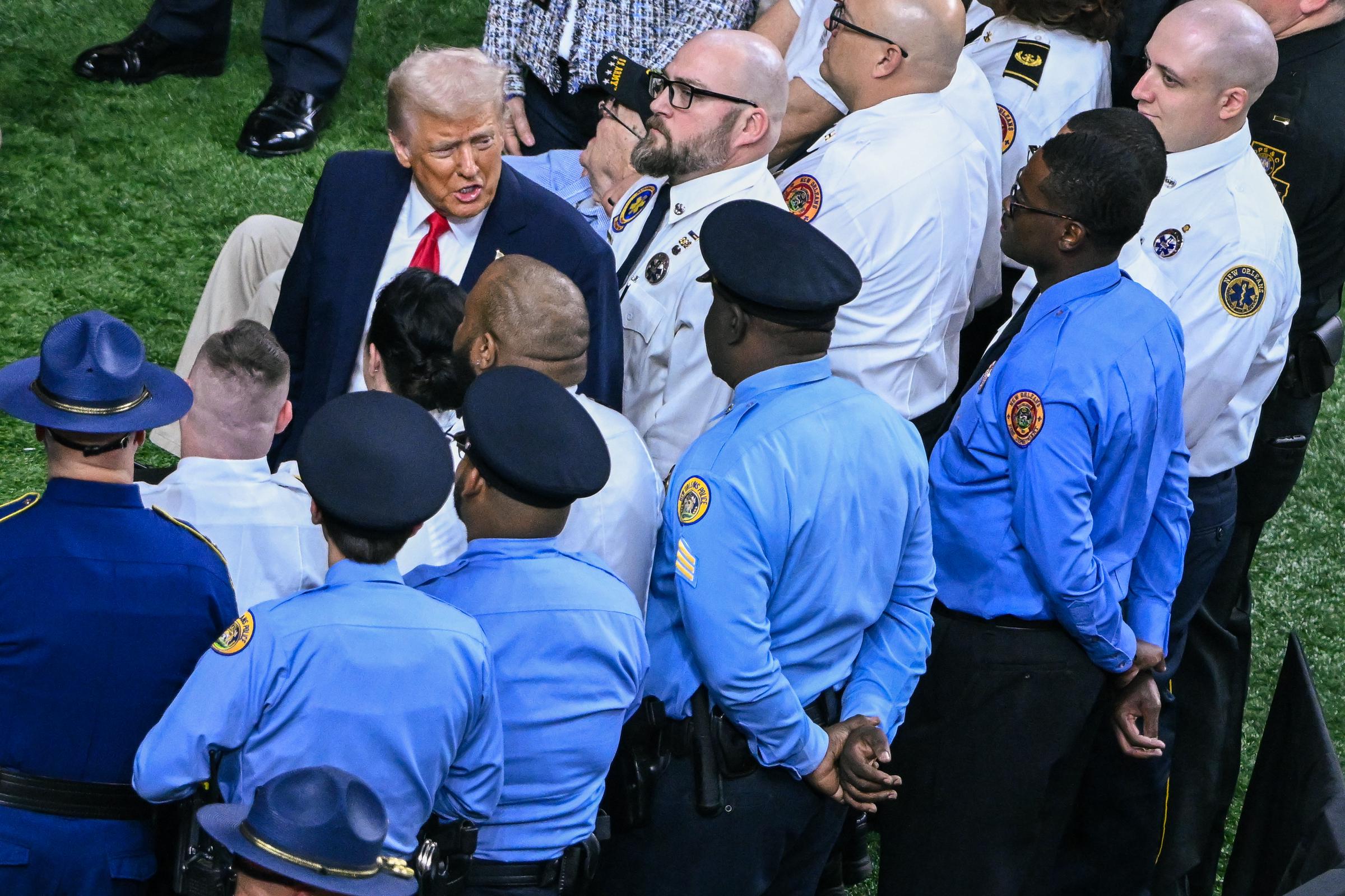 Donald Trump pictured with a security team at the Super Bowl LIX on February 9, 2025, in New Orleans, Louisiana. | Source: Getty Images