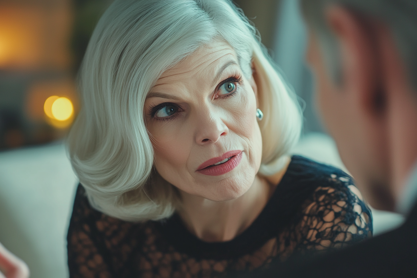 A woman with a serious expression speaking to someone | Source: Midjourney