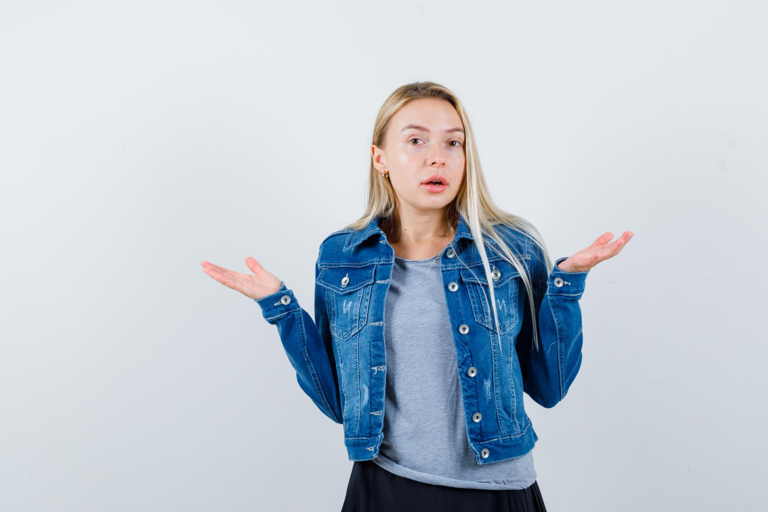 A woman shrugging | Source: Freepik