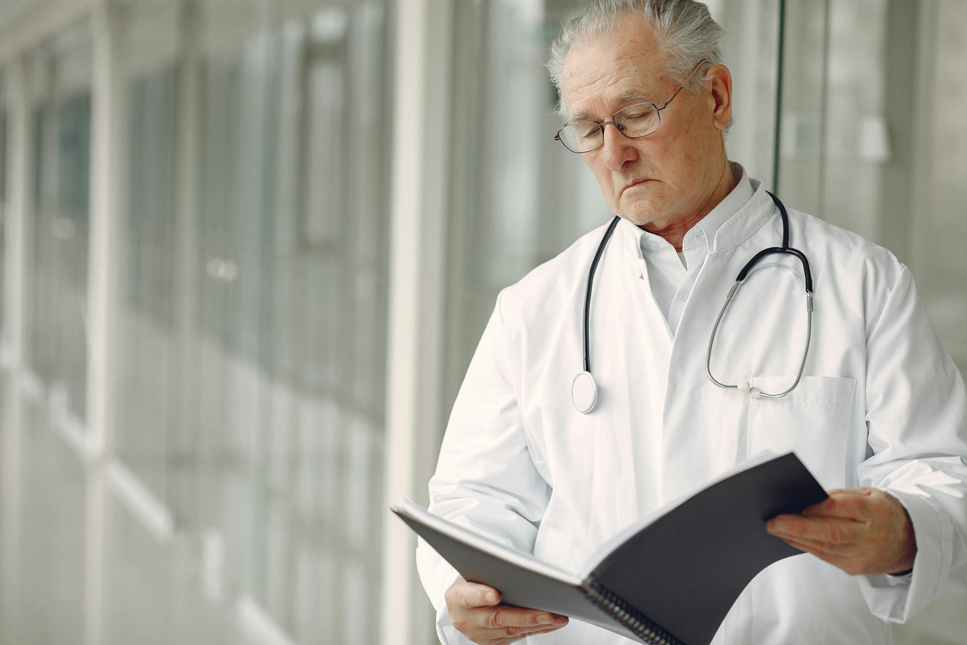 A doctor examining a file | Source: Pexels