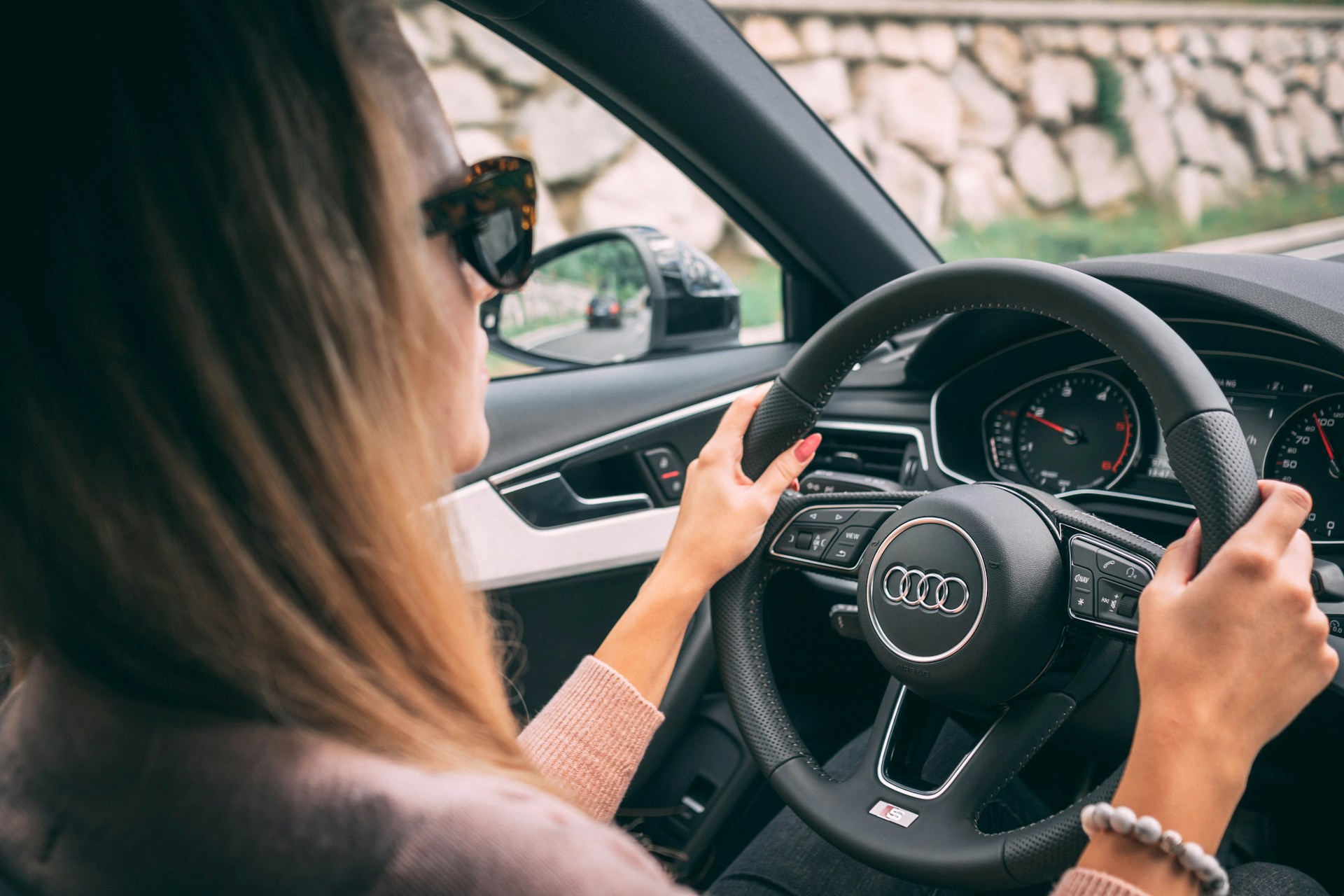A woman sitting in her car | Source: Unsplash