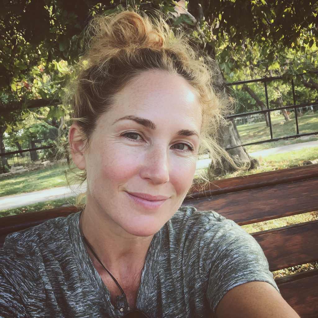 A smiling woman with her hair in a bun | Source: Midjourney
