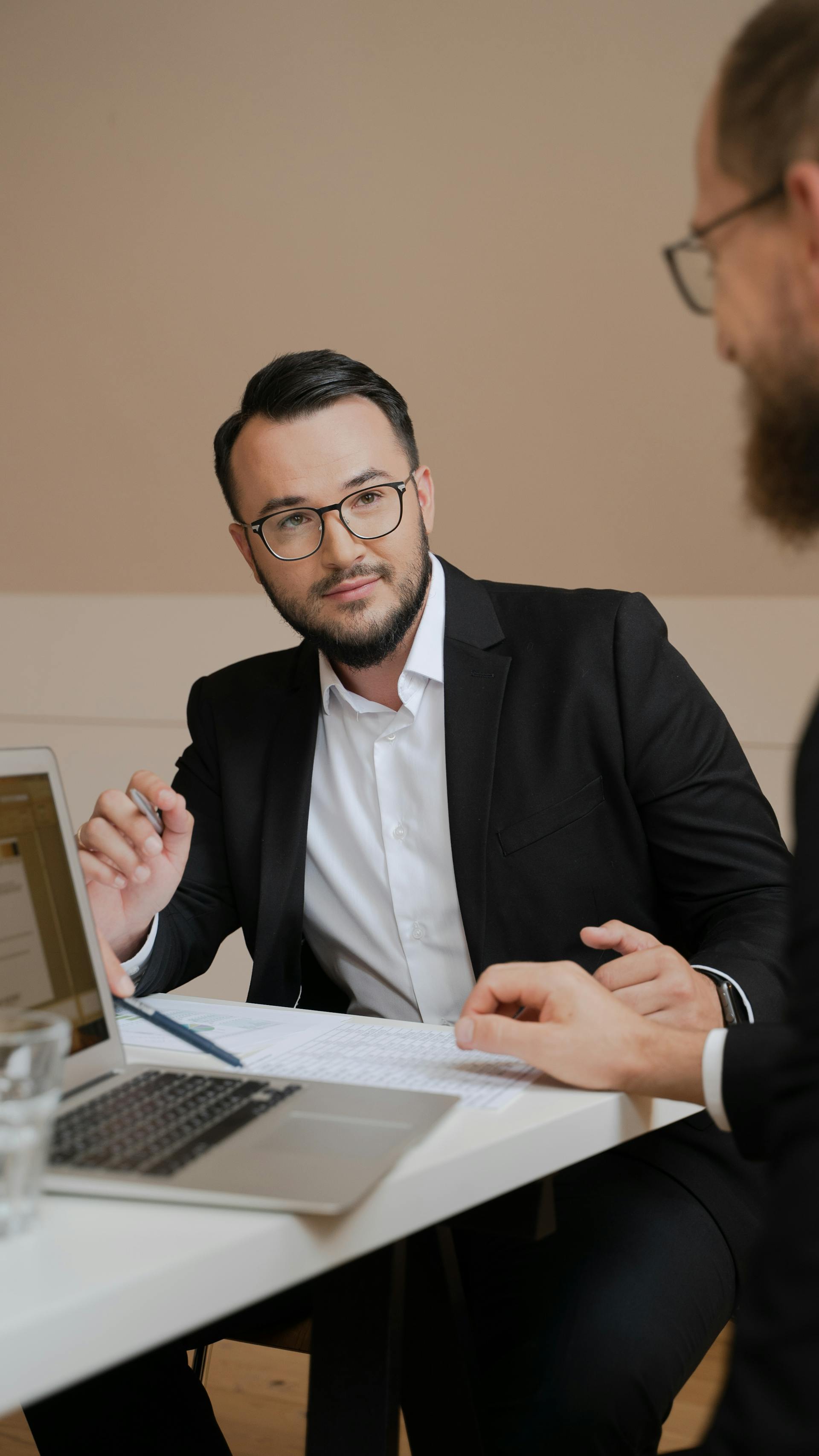 Men sitting in an office | Source: Pexels