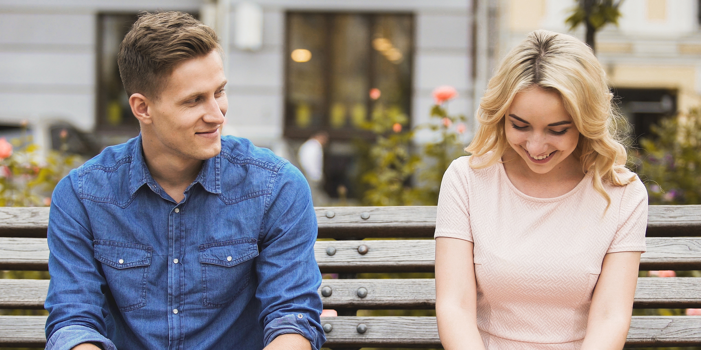 A couple sitting on a bench | Source: Shutterstock