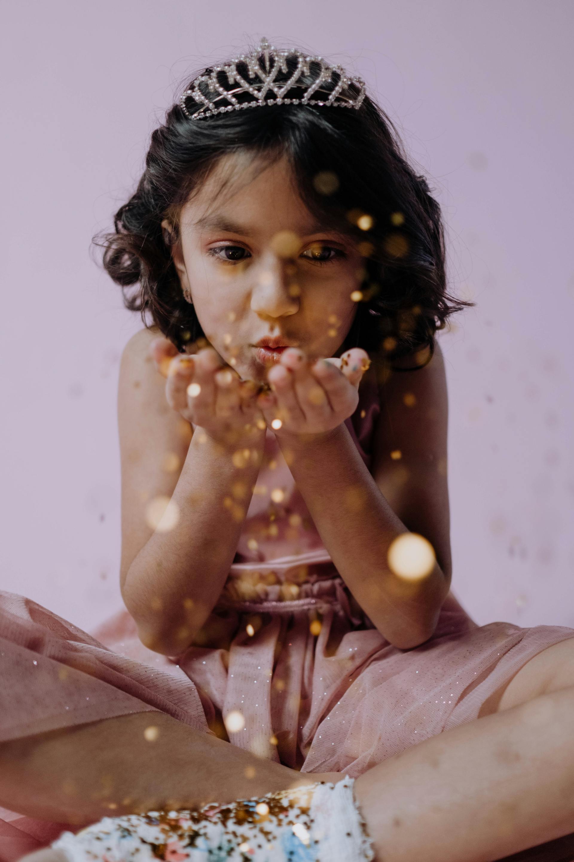 A girl wearing a dress and tiara | Source: Pexels