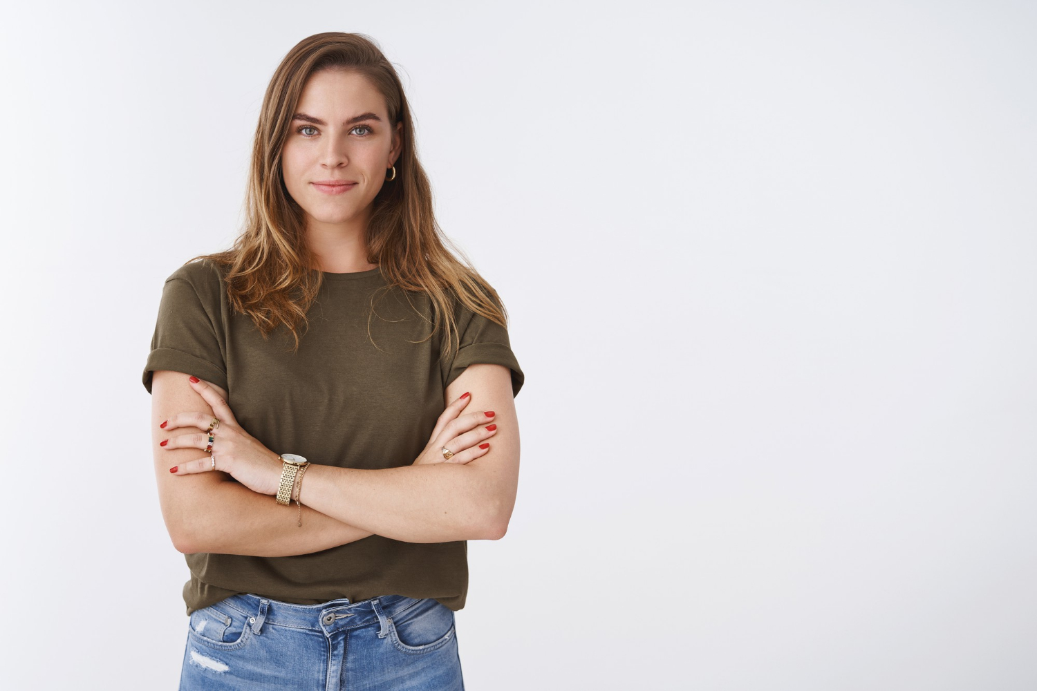 A confident woman with her arms crossed | Source: Freepik