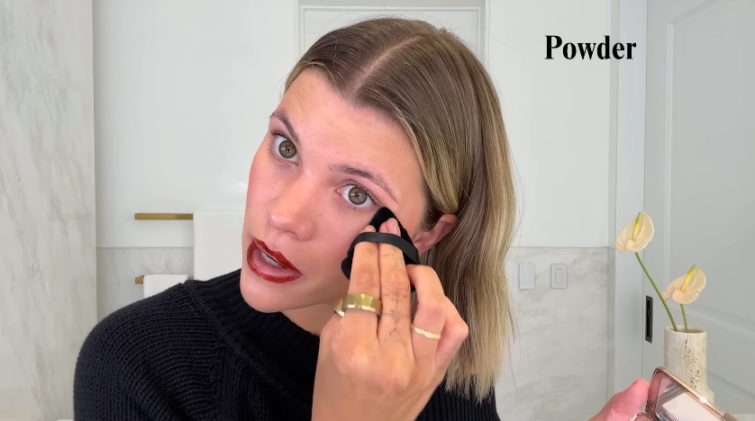 Sofia Richie doing her beauty routine from a video dated July 25, 2025. | Source: YouTube/Vogue