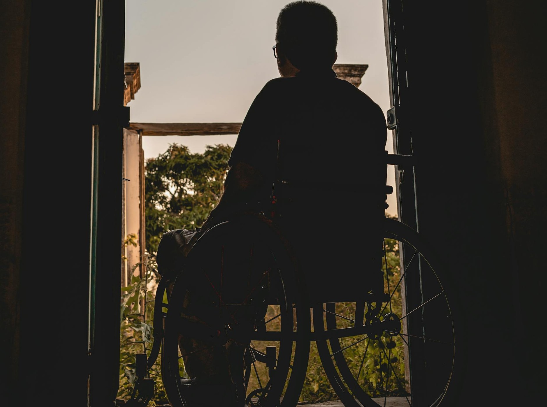 Cropped shot of an older man sitting in a wheelchair | Source: Pexels