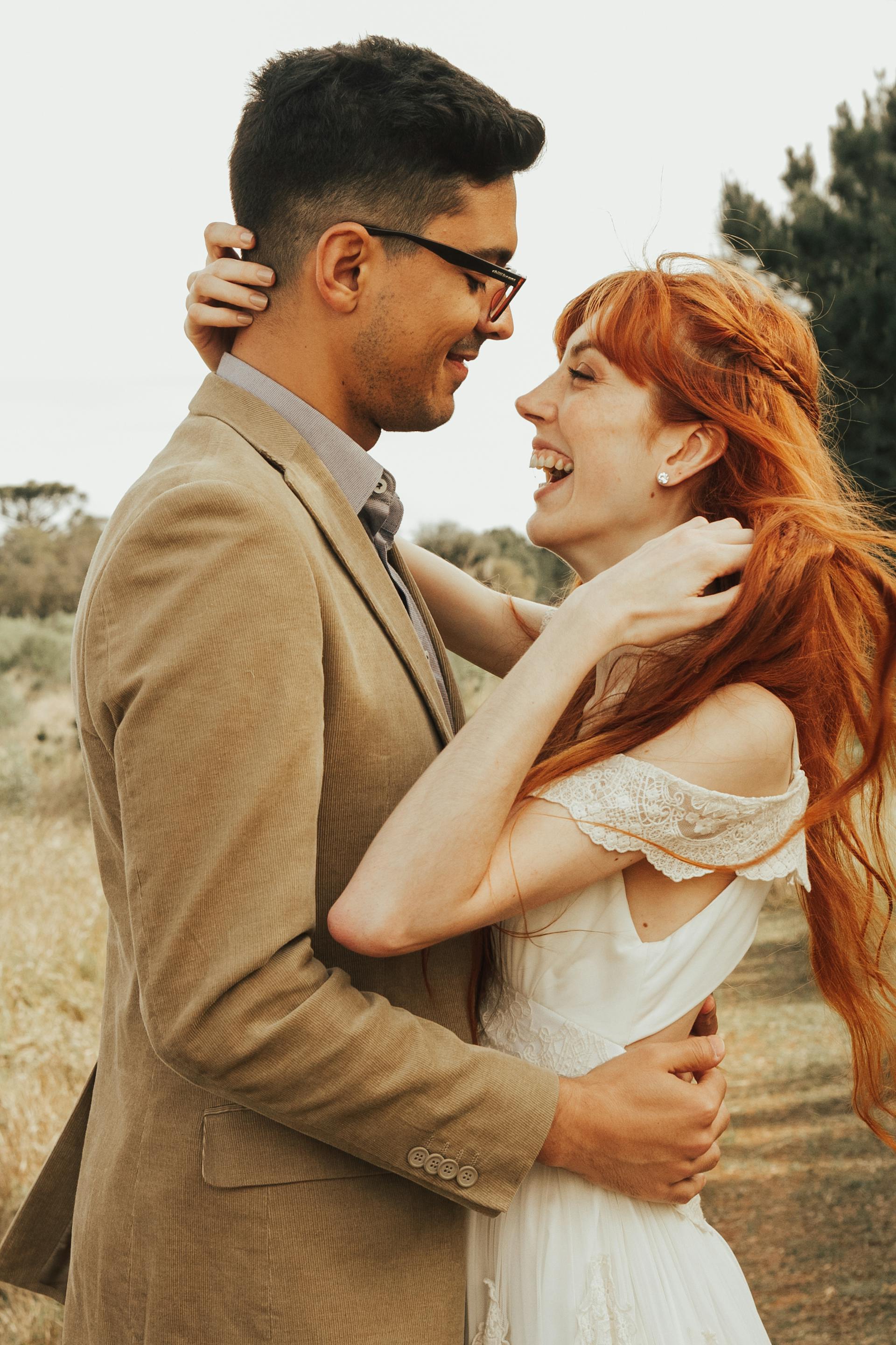 A bride and groom laughing | Source: Pexels
