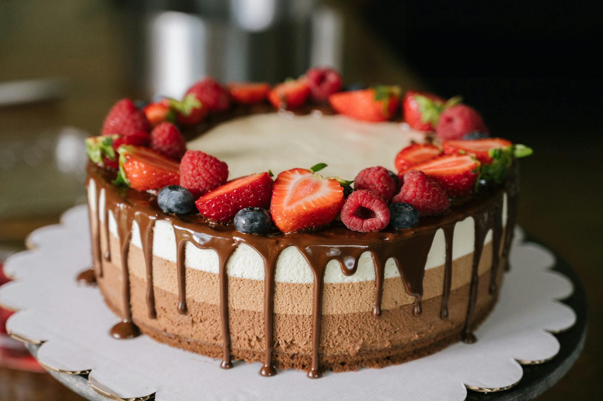 A homemade cake topped with fruits | Source: Pexels