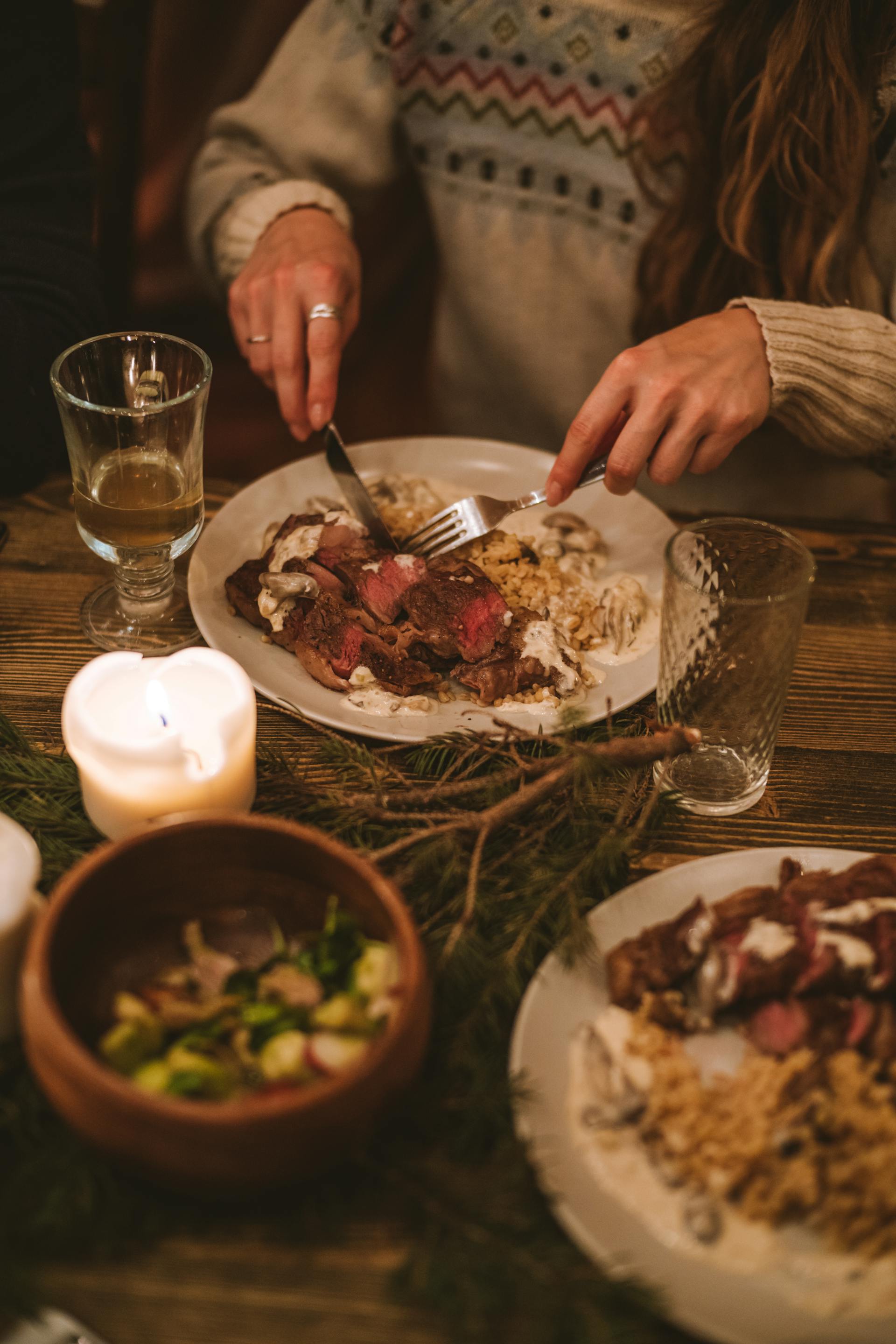 A woman at a festive dinner | Source: Pexels