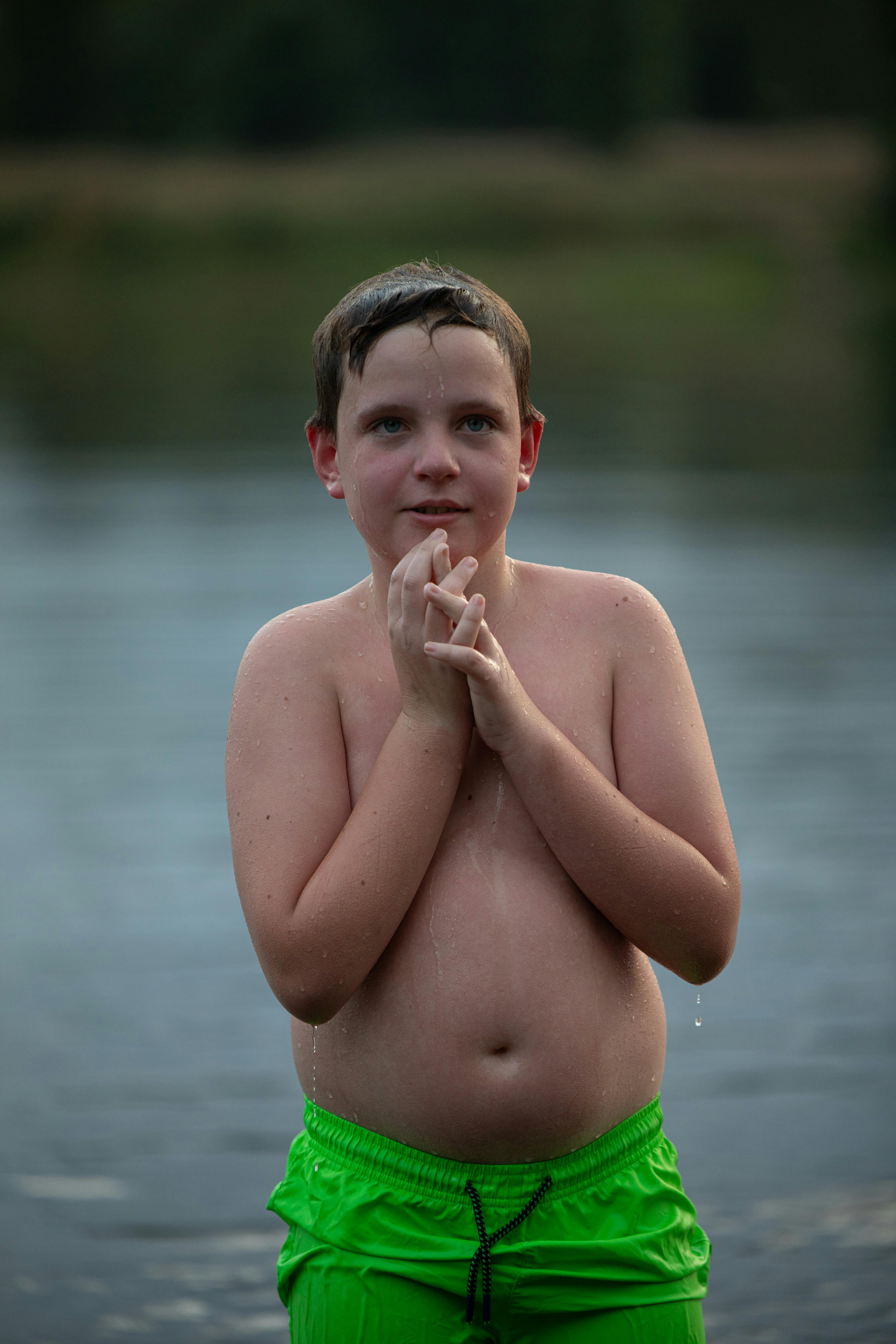 A child standing in water | Source: Pexels