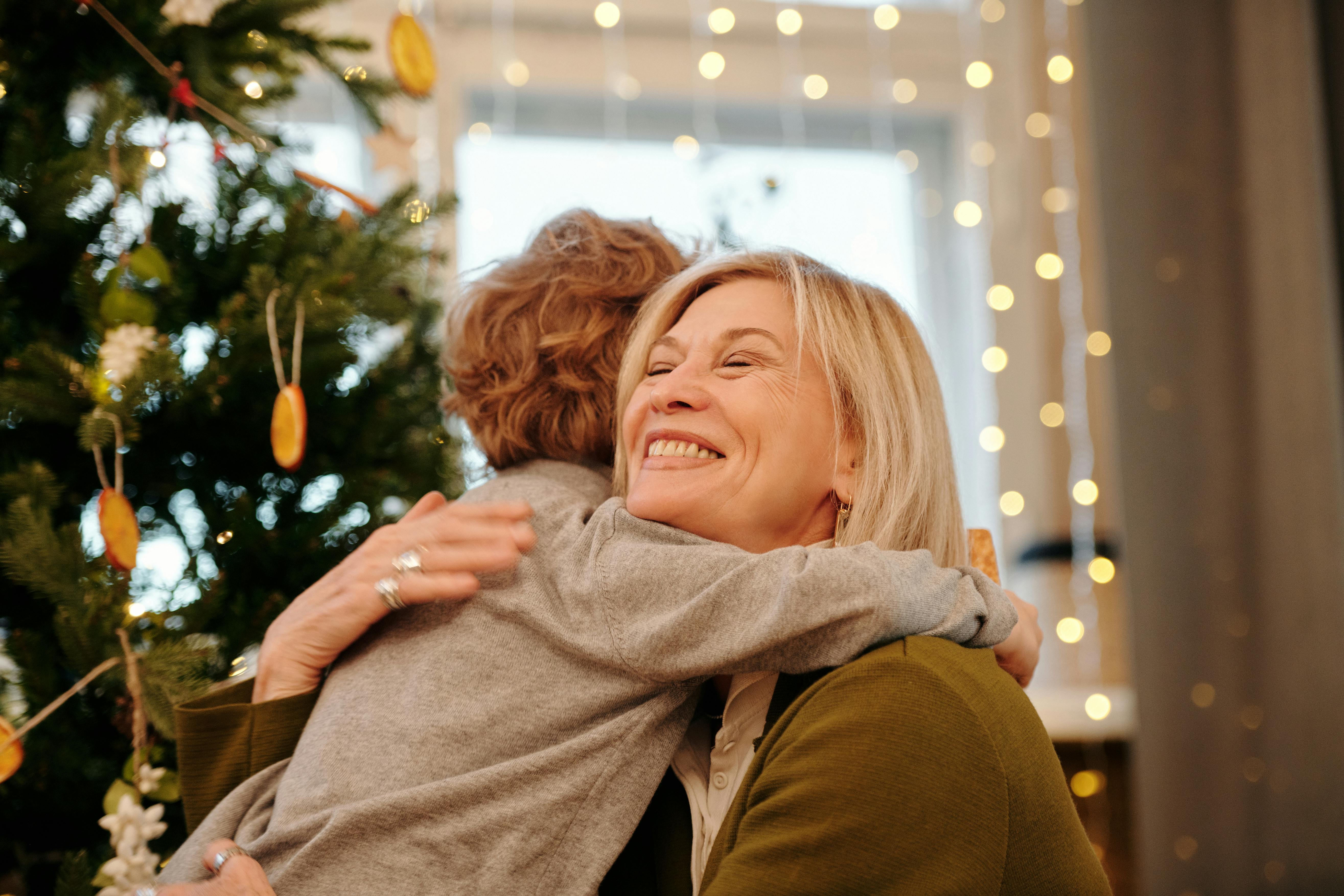 A grandmother hugs her grandson | Source: Pexels