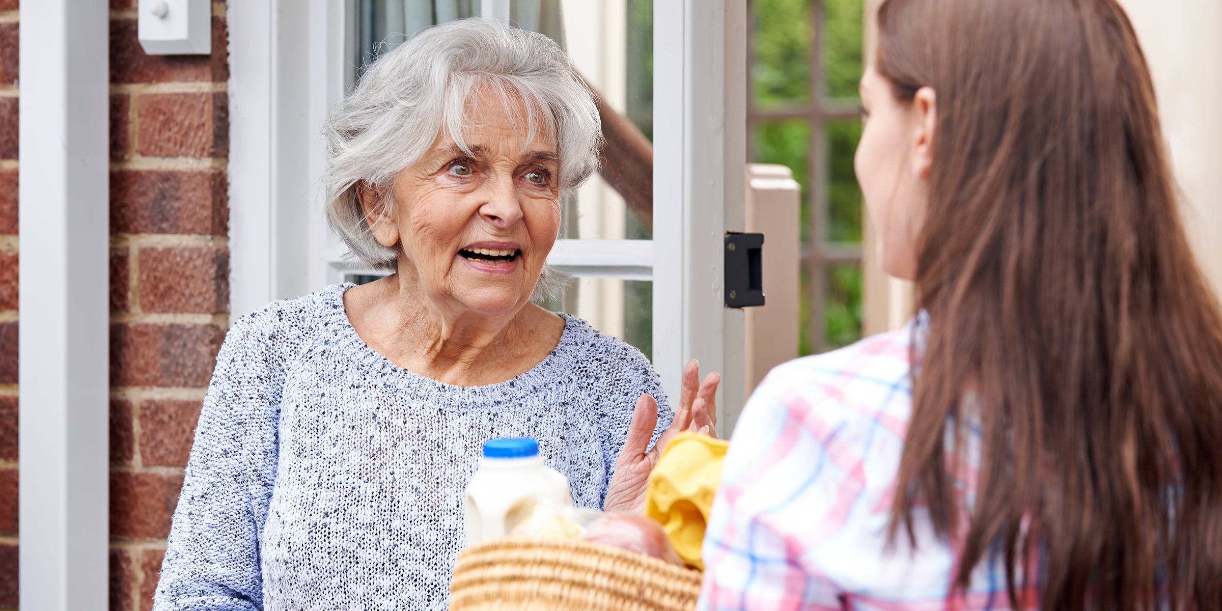 An elderly lady talking to a woman | Source: Shutterstock