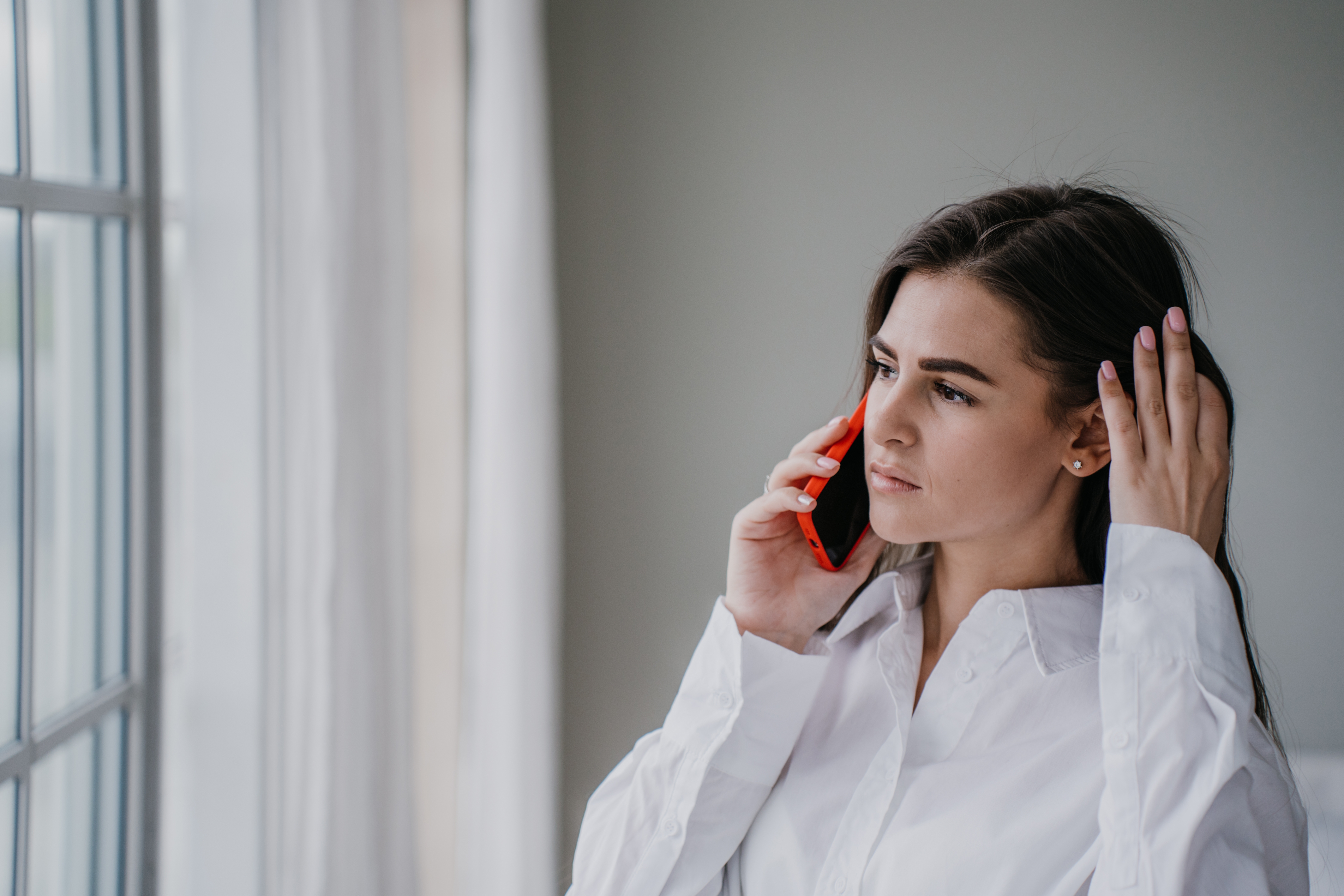 A woman talking on the phone | Source: Shutterstock