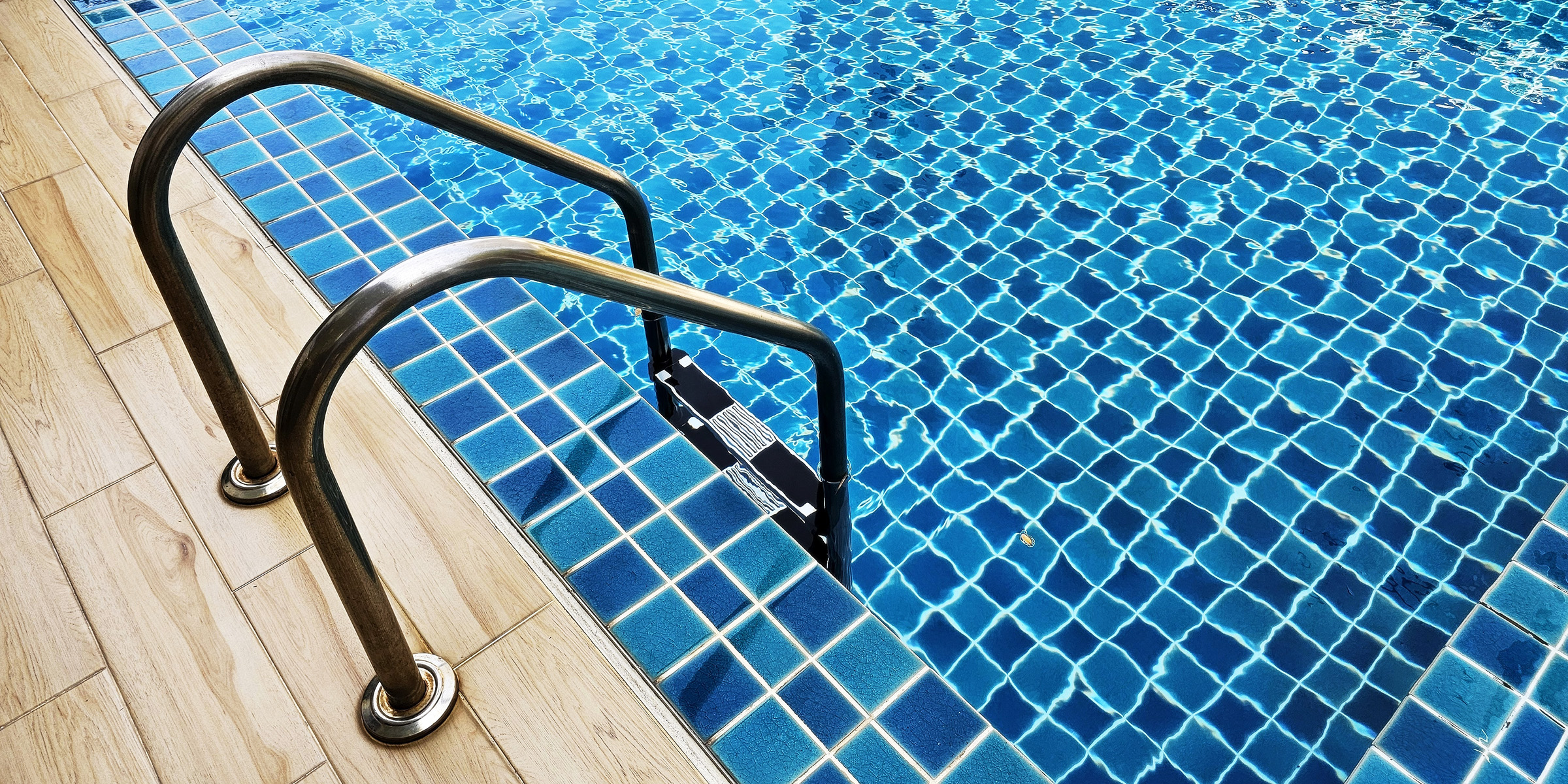 A steel swimming pool ladder | Source: Shutterstock
