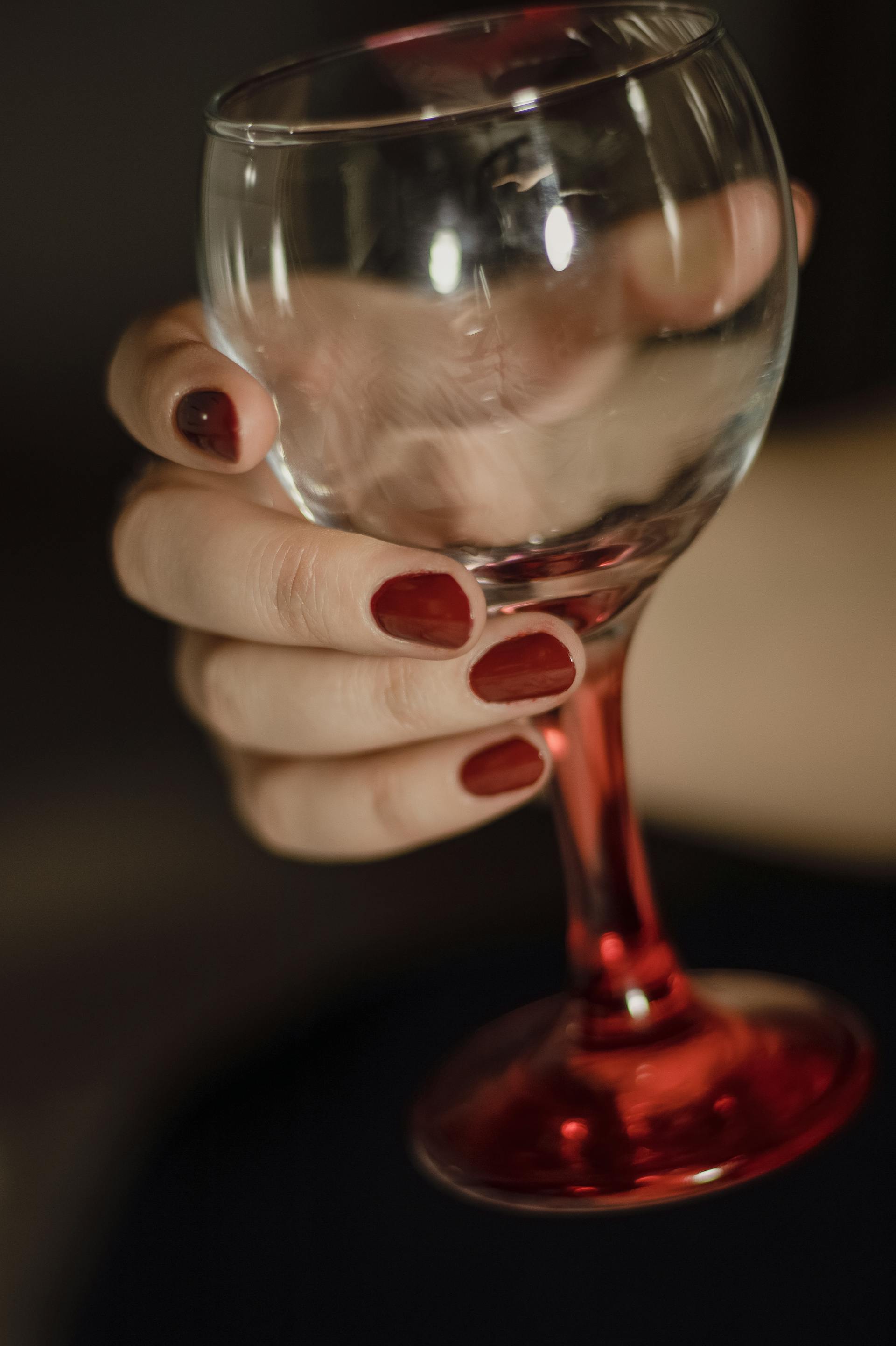 A woman holding a wine glass | Source: Pexels