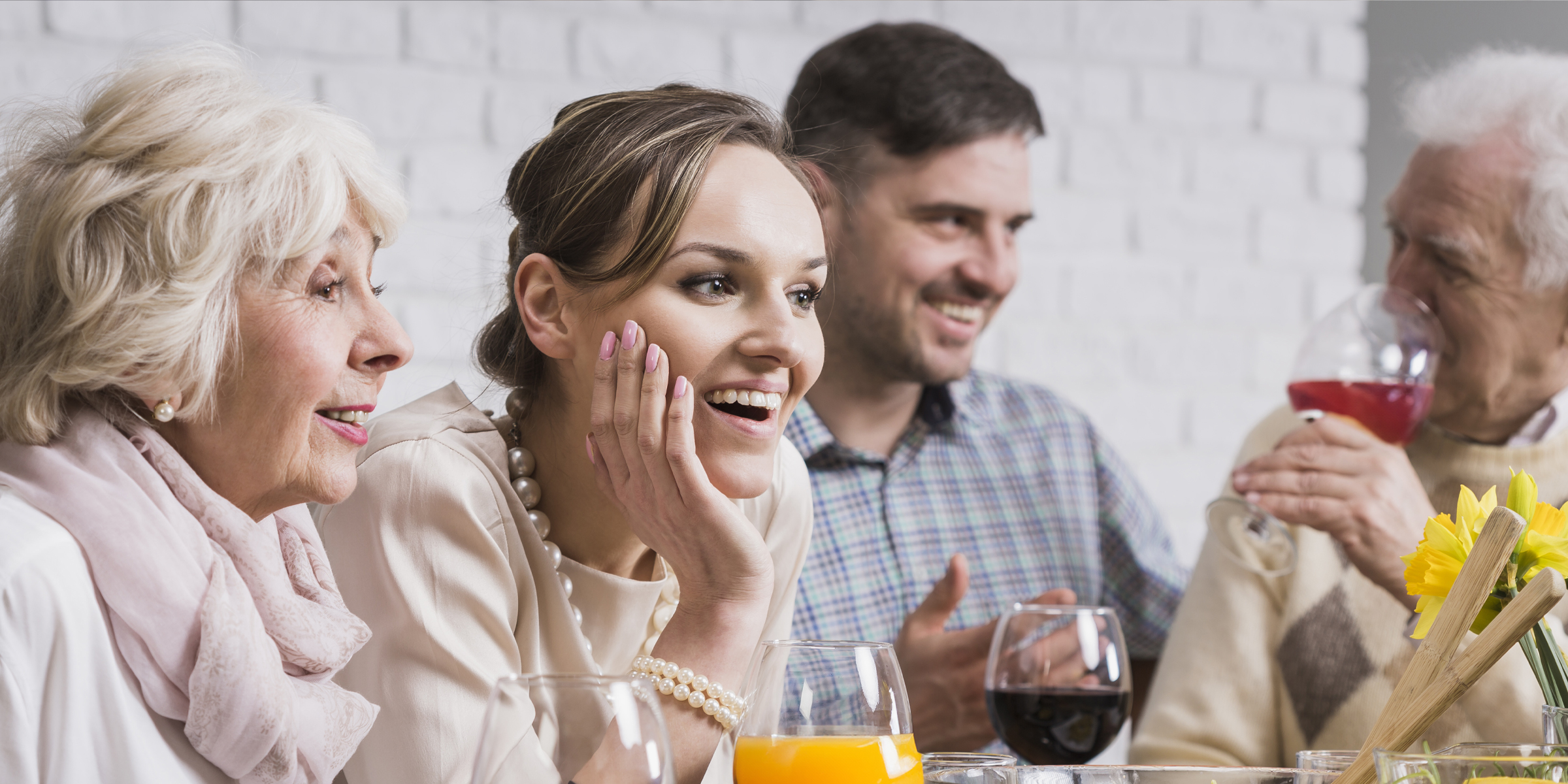 A family gathering filled with laughter, drinks, and warm conversation | Source: Shutterstock