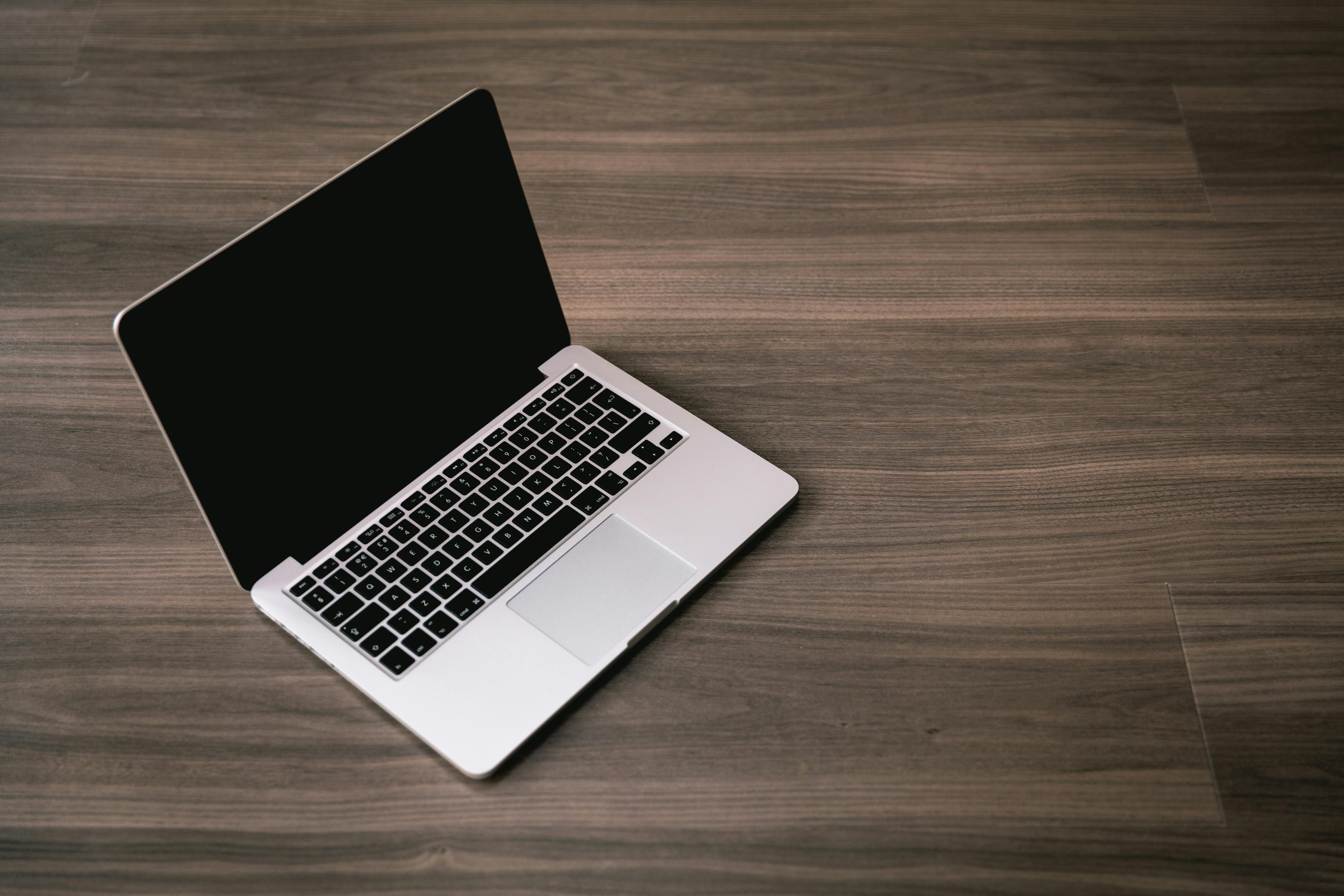 Laptop on a brown background | Source: Midjourney