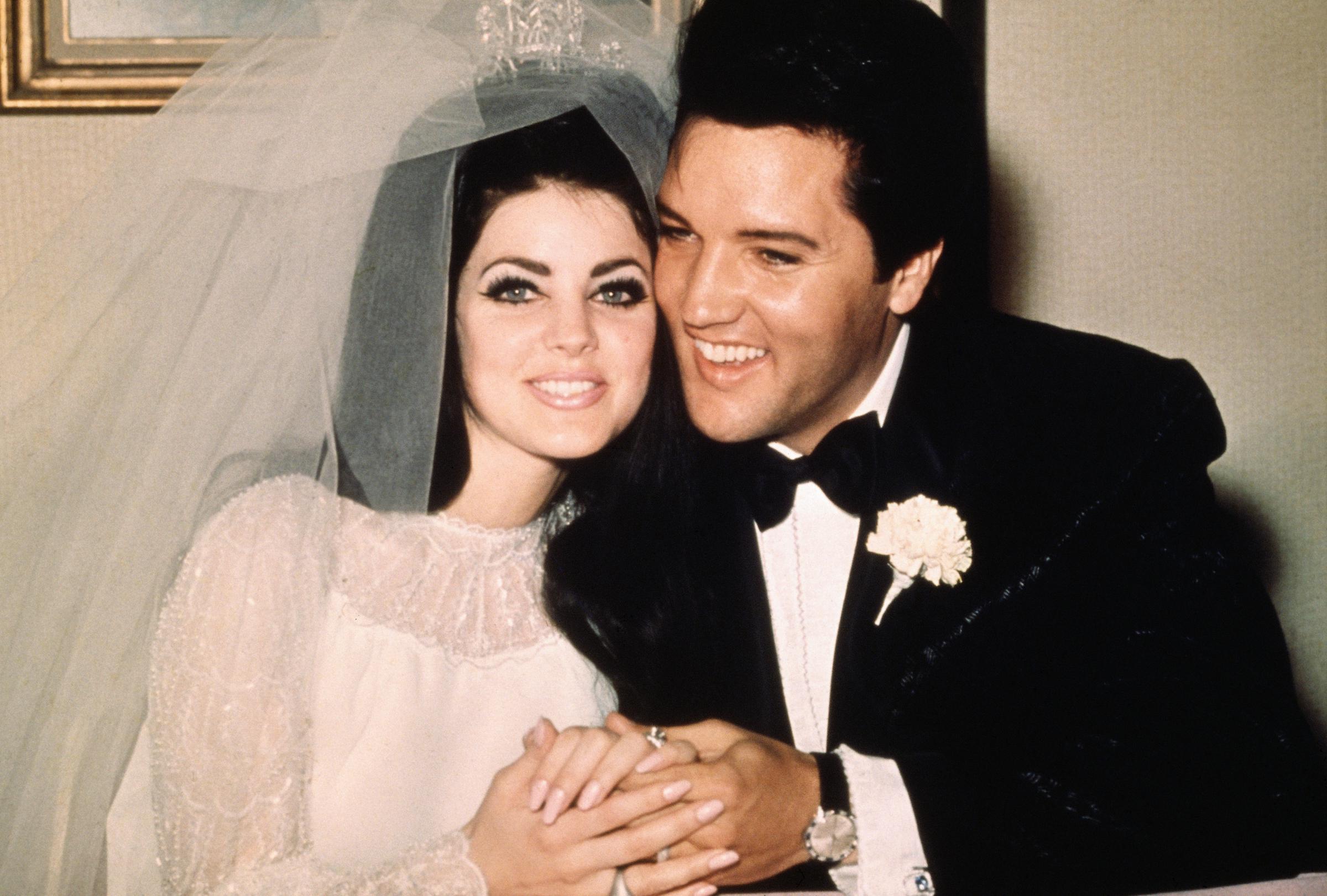 Elvis Presley and Priscilla Presley pose together on their wedding day, capturing a chapter of their relationship that remains central to her wishes for her final resting place. | Source: Getty Images