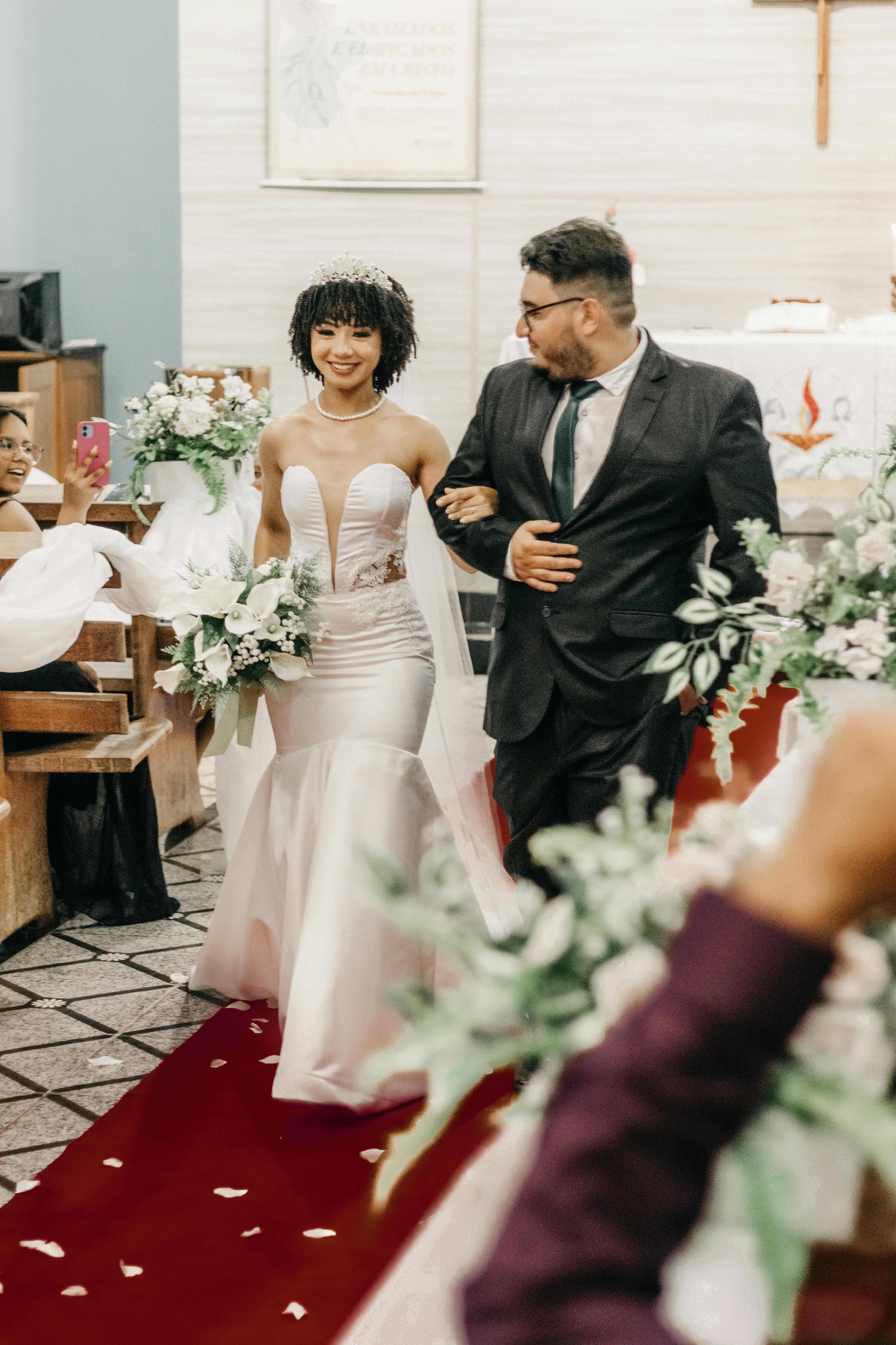 A newlywed couple leaving the church following their vows | Source: Pexels
